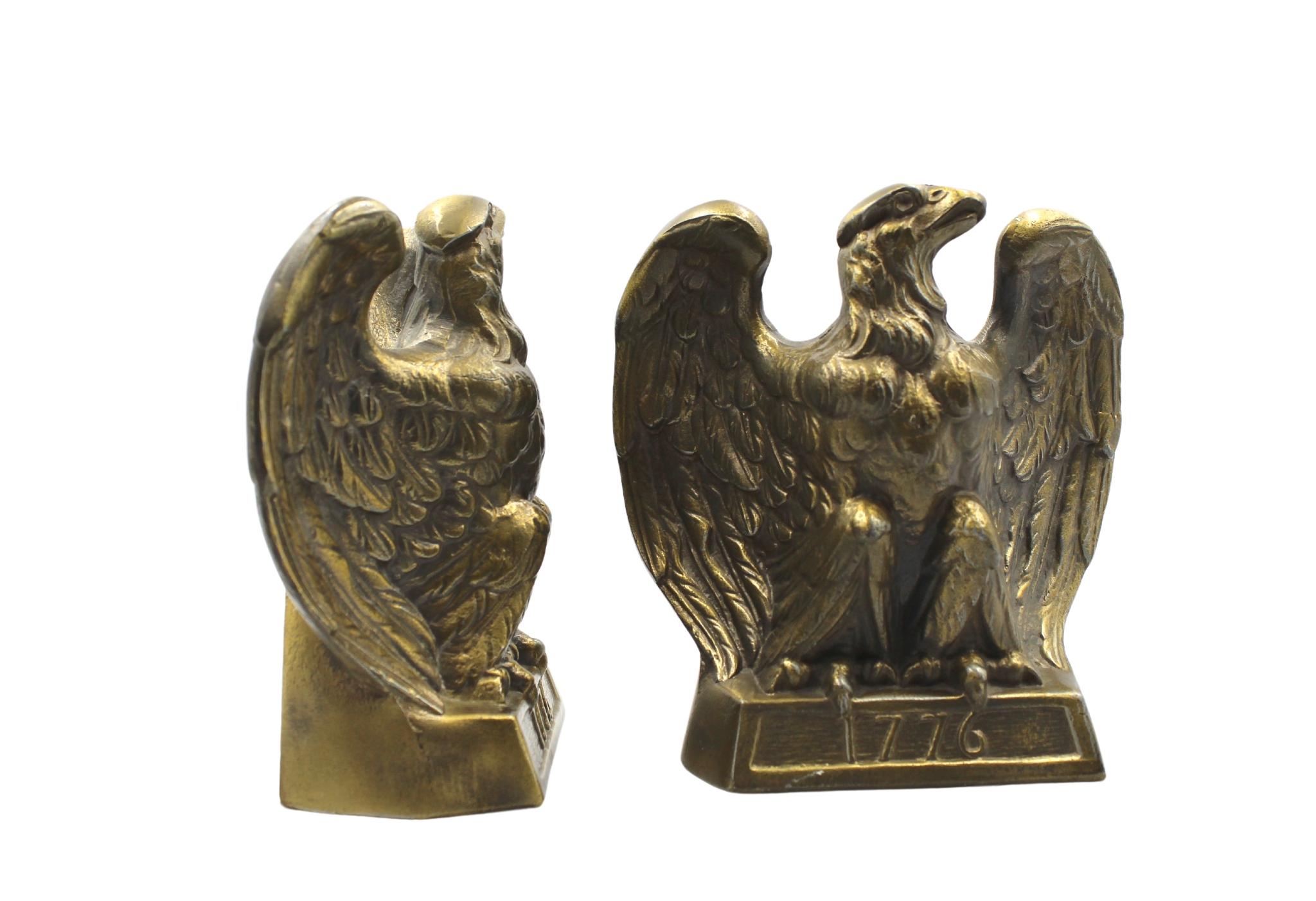 These appealing vintage brass bookends depict a bald eagle preparing for flight after perching on a base inscribed with “1776.” The bookends were made by Colonial Virginia, a crafter working out of Hampton, Virginia in 1972. The realistic detail of