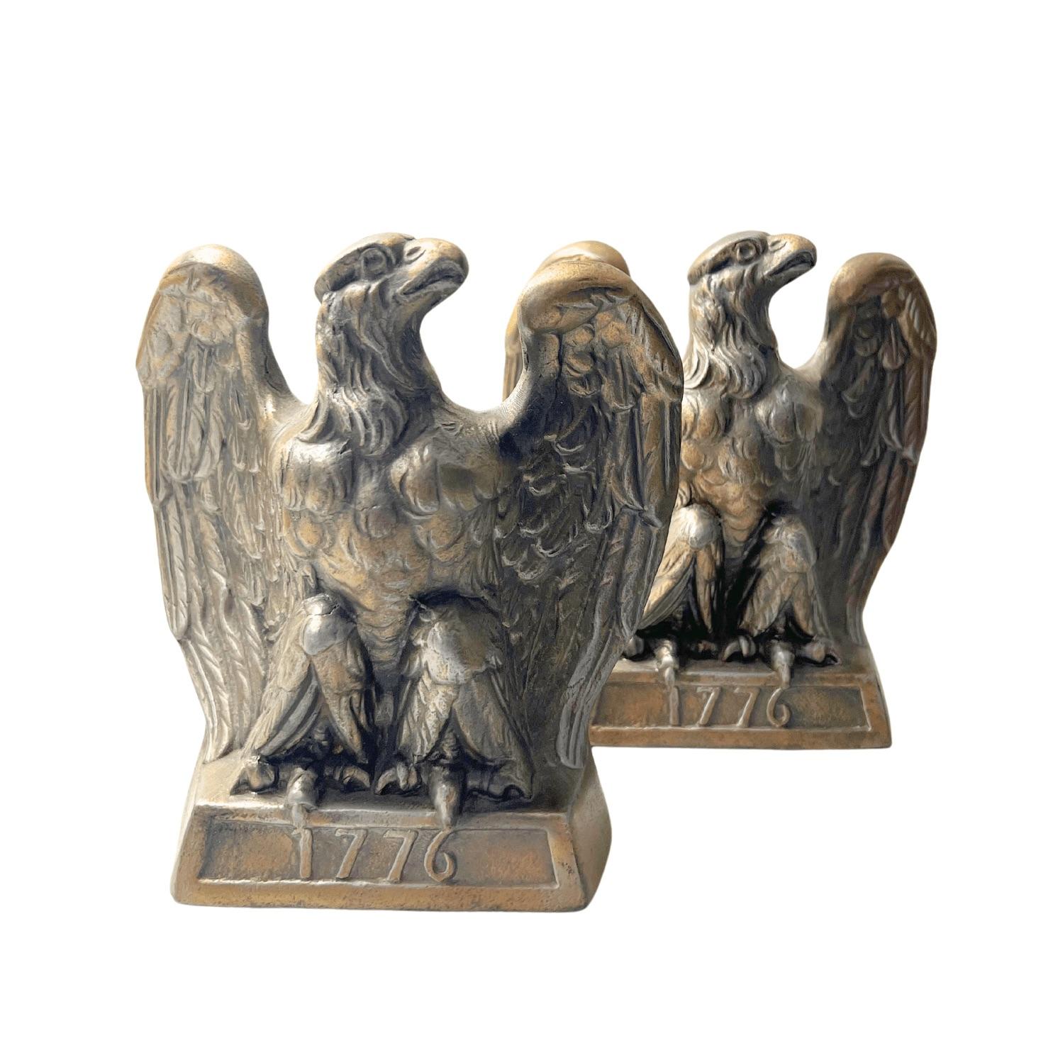 This is an appealing set of vintage brass bookends. The bookends each depict a spread-wing bald eagle perched on a rectangular base, stamped with the date “1776.” The bookends were made by Colonial Virginia, a crafter working out of Hampton,