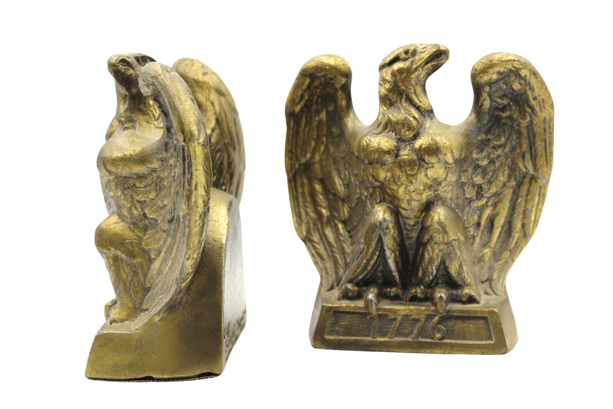This is an appealing set of vintage brass bookends. The bookends each depict a spread-wing bald eagle perched on a rectangular base, stamped with the date “1776.” The bookends were made by Colonial Virginia, a crafter working out of Hampton,