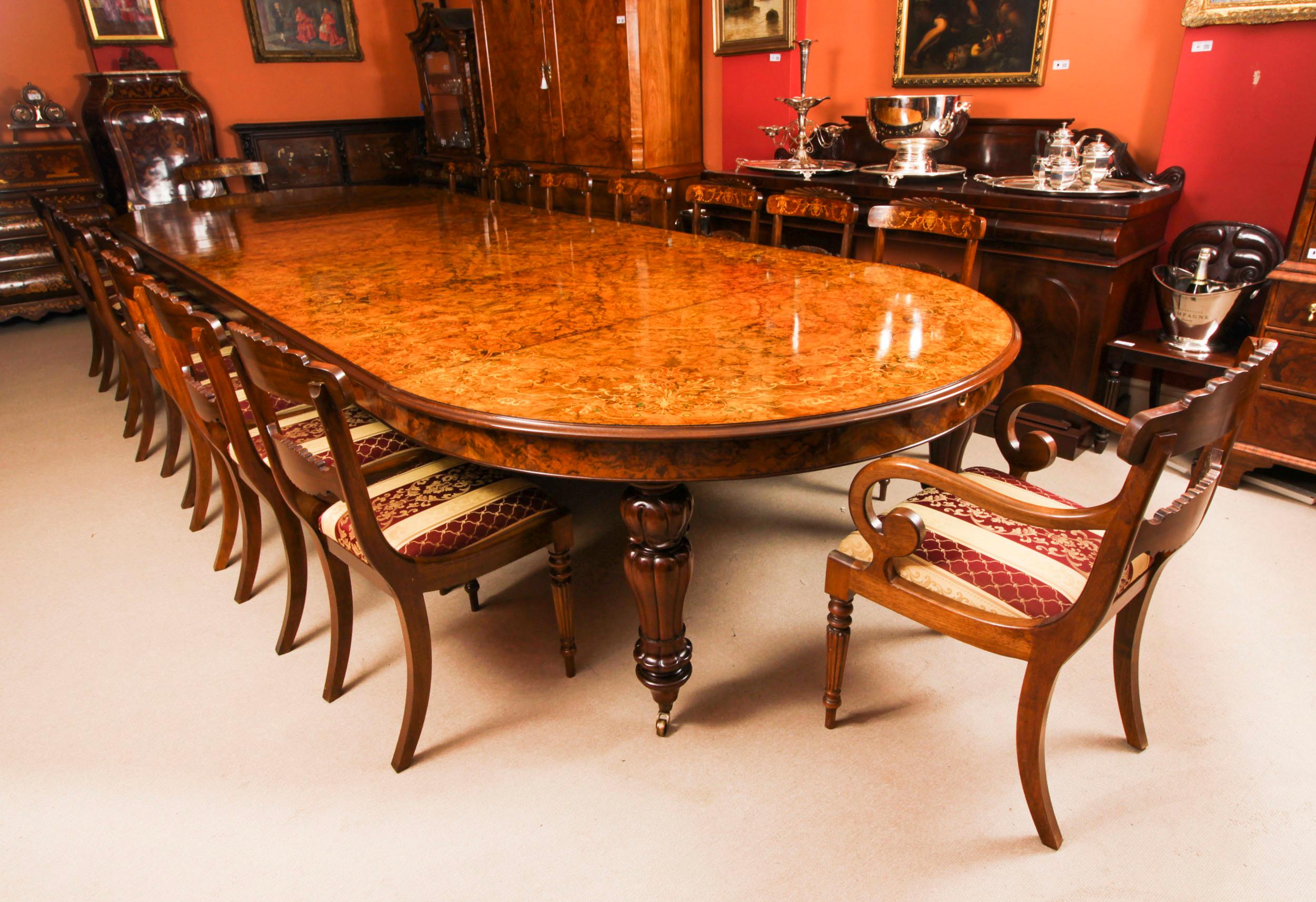 This is a fantastic Vintage Victorian Revival 5 meter burr walnut and marquetry  dining room table, dating from the last quarter of the 20th Century.
The table is made from book matched burr walnut veneers which have a really beautiful colour and