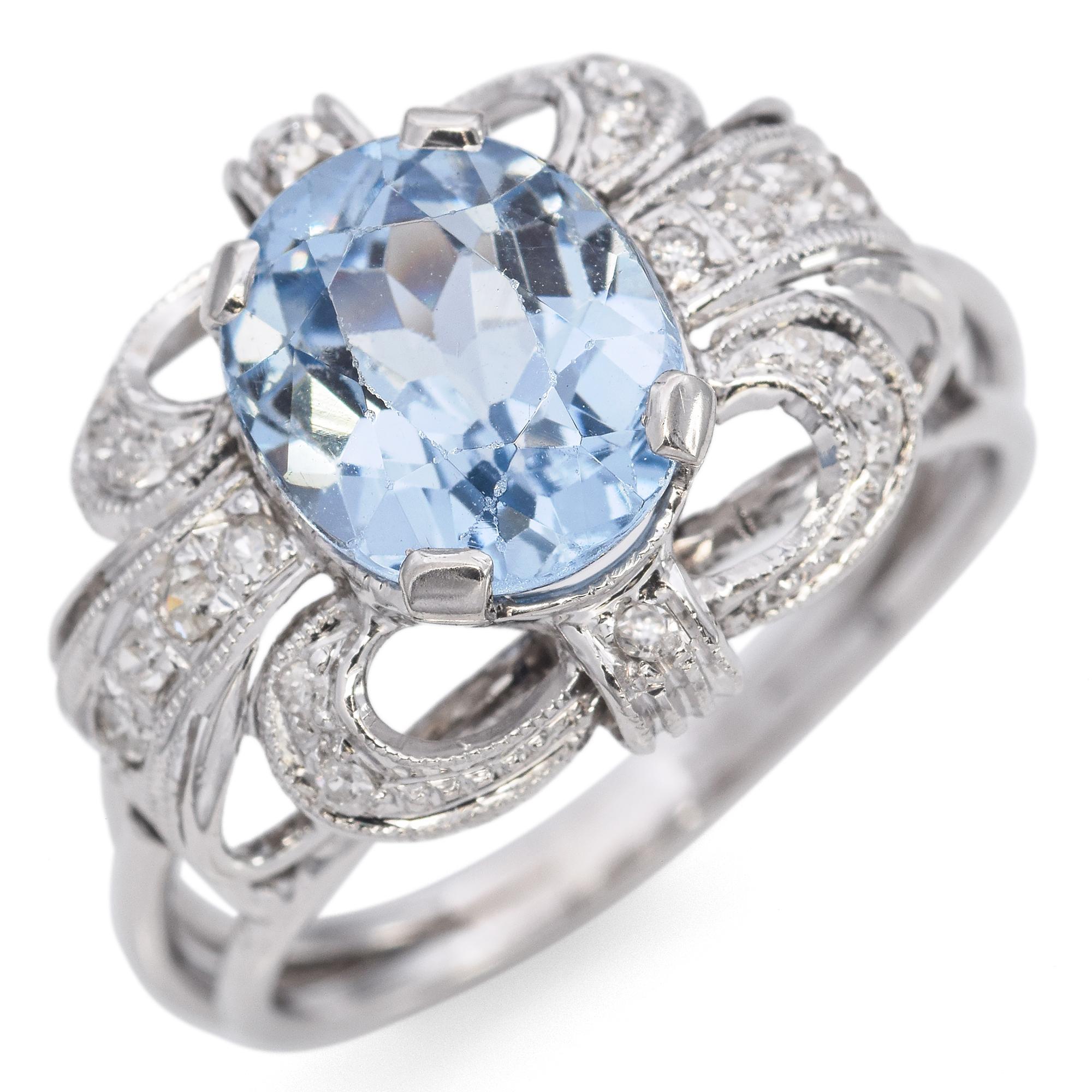 Experience the elegance of our exquisite Blue Topaz and Diamond Ring. This captivating piece, set in white gold, features a stunning oval-cut blue topaz at its center, radiating a serene and enchanting hue. The intricate design is enhanced by