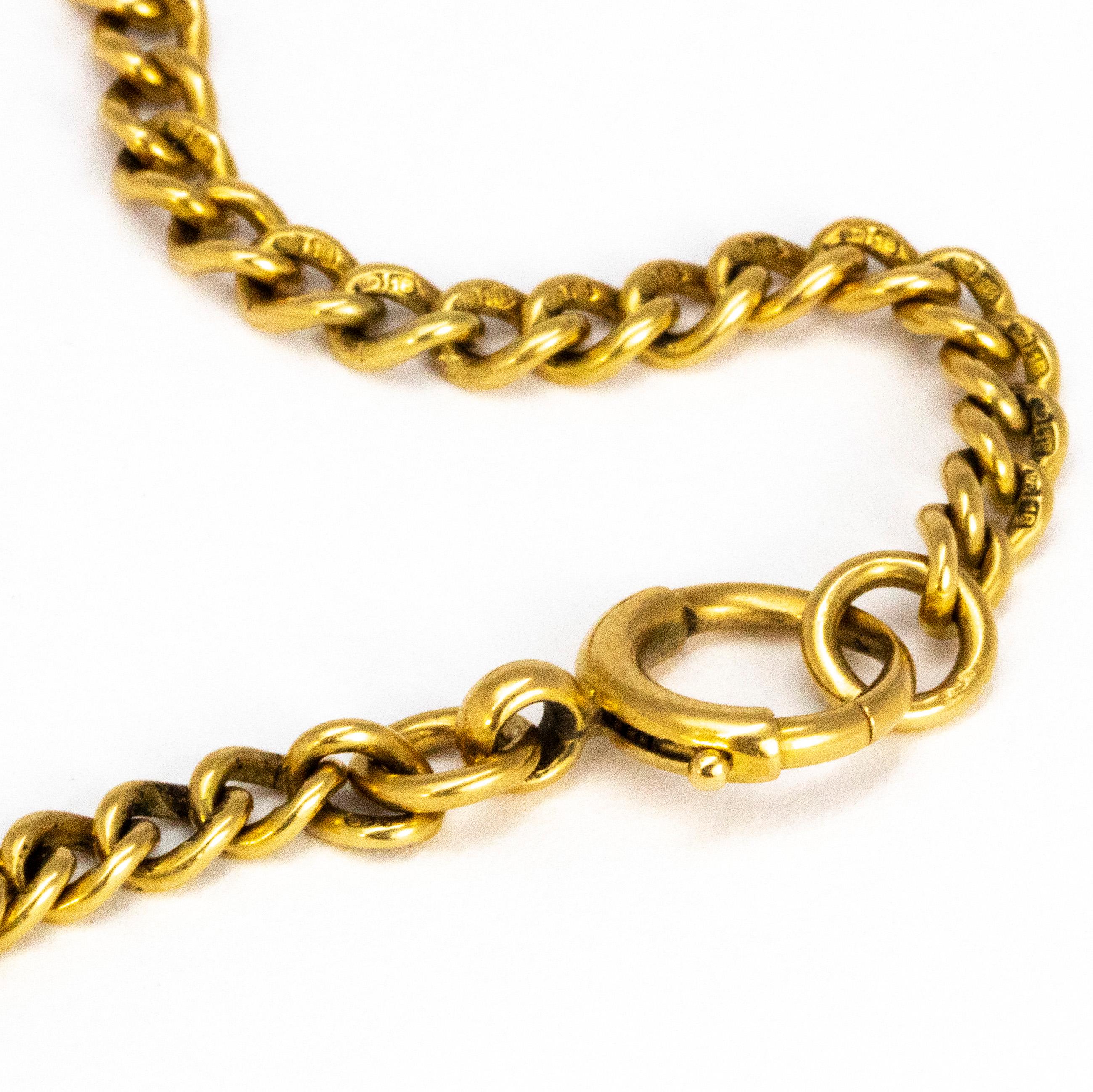 This delicate curb chain bracelet is slim and modelled in glossy 18ct gold. The bracelet is fastened by simple clasp and loop. Each link is hallmarked. 

Length: 18.5cm
Width: 4mm