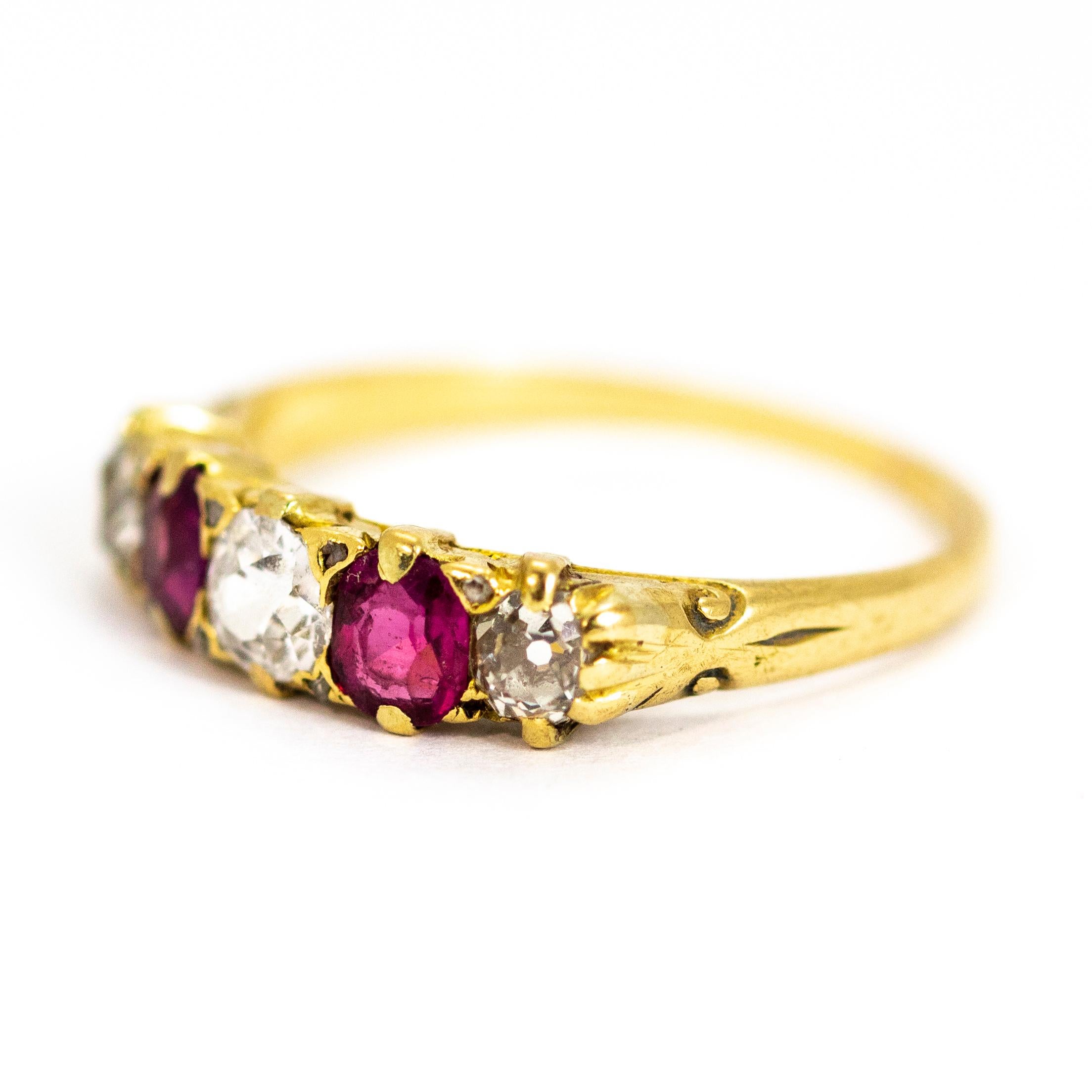 An exquisite vintage five-stone ring set with diamonds and rubies. The central diamonds measures 45 points, G colour and VVSI clarity. This superb stone is flanked by a pair of beautiful rubies, and then another pair of 20 point diamonds. Between