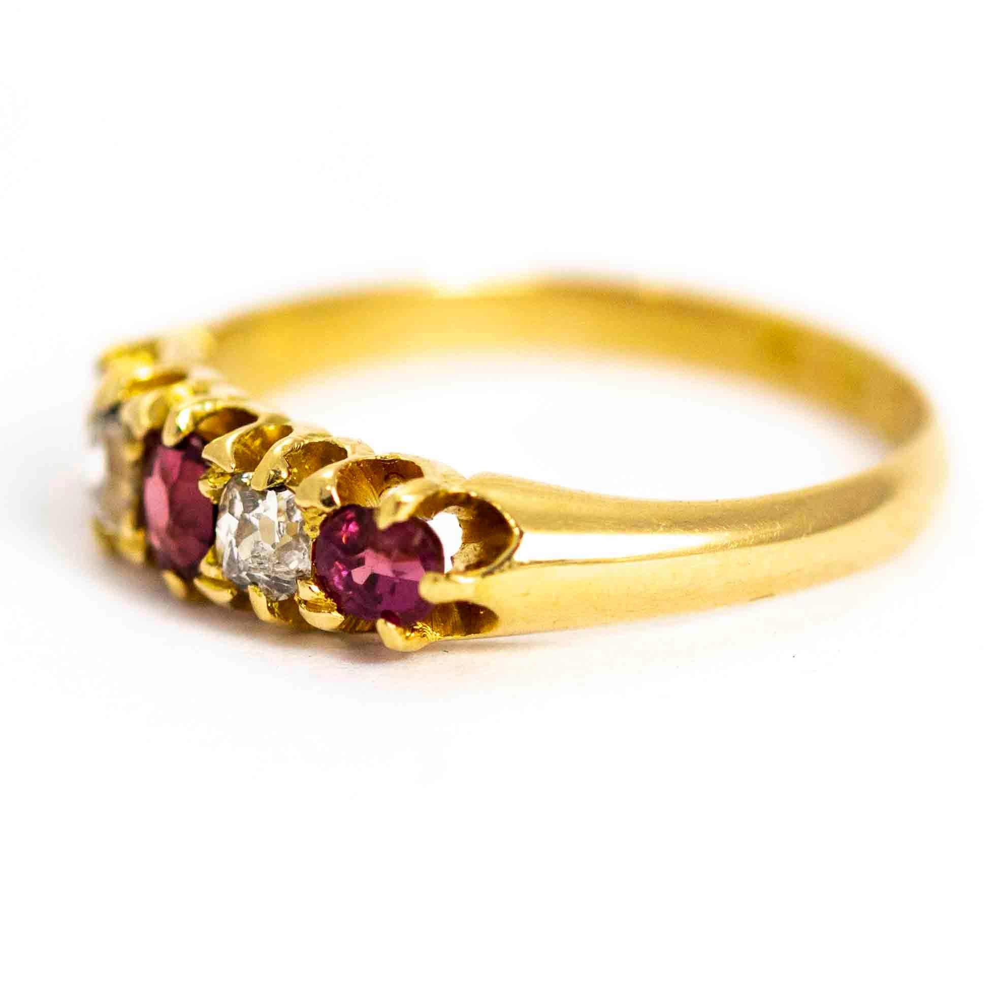 A superb vintage five-stone ring set with rubies and diamonds. The central ruby measures approximately 18 points, and is flanked by a pair of beautiful 15 point diamonds. The rubies at the ends of the row measure approximately 12 points each.