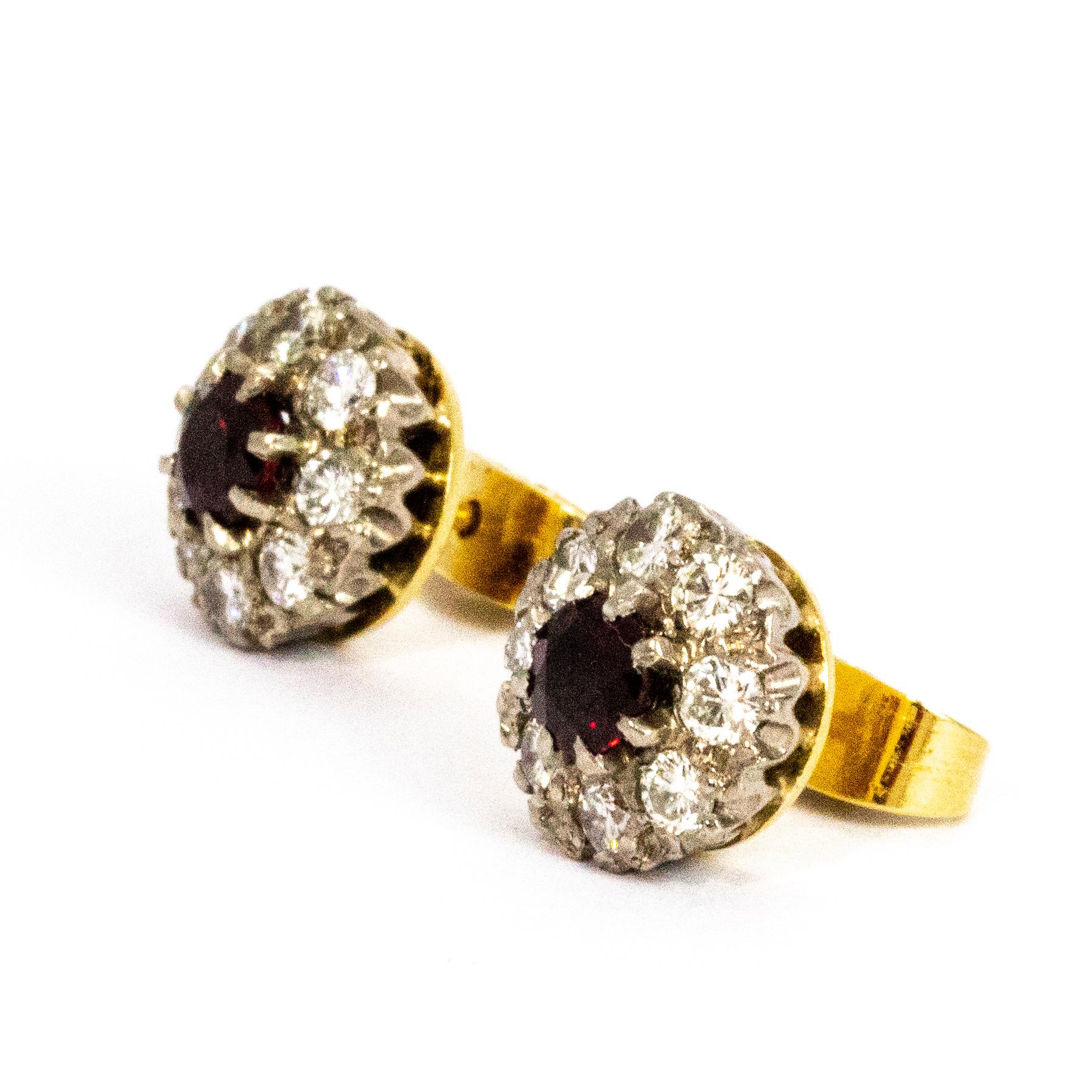A wonderful pair of vintage earrings set with exquisite ruby and diamond clusters. The central rubies each measure approximately 30 points each and have stunning deep red colouring, they are surrounded by beautiful halos of white diamonds. The total