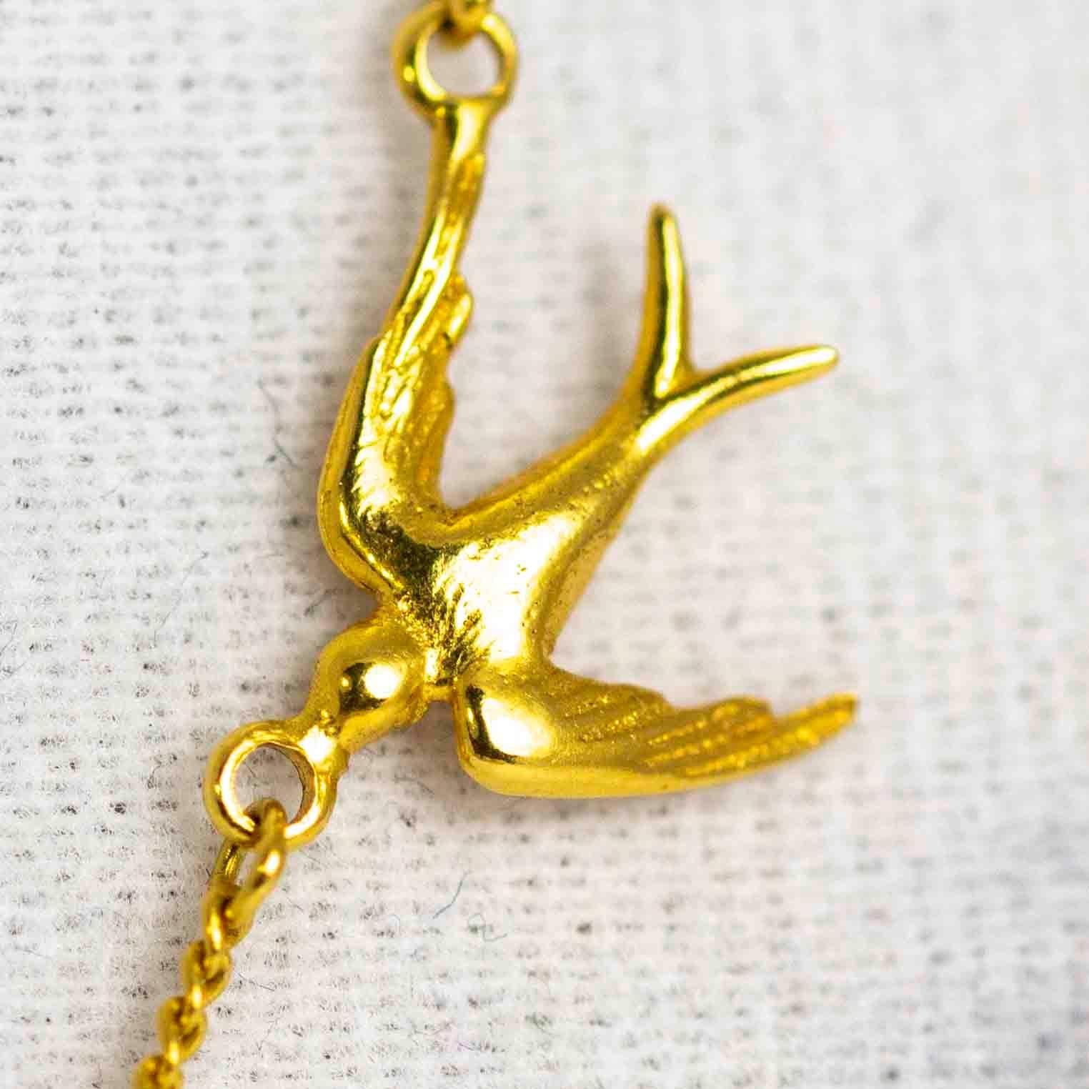 gold swallow pendant