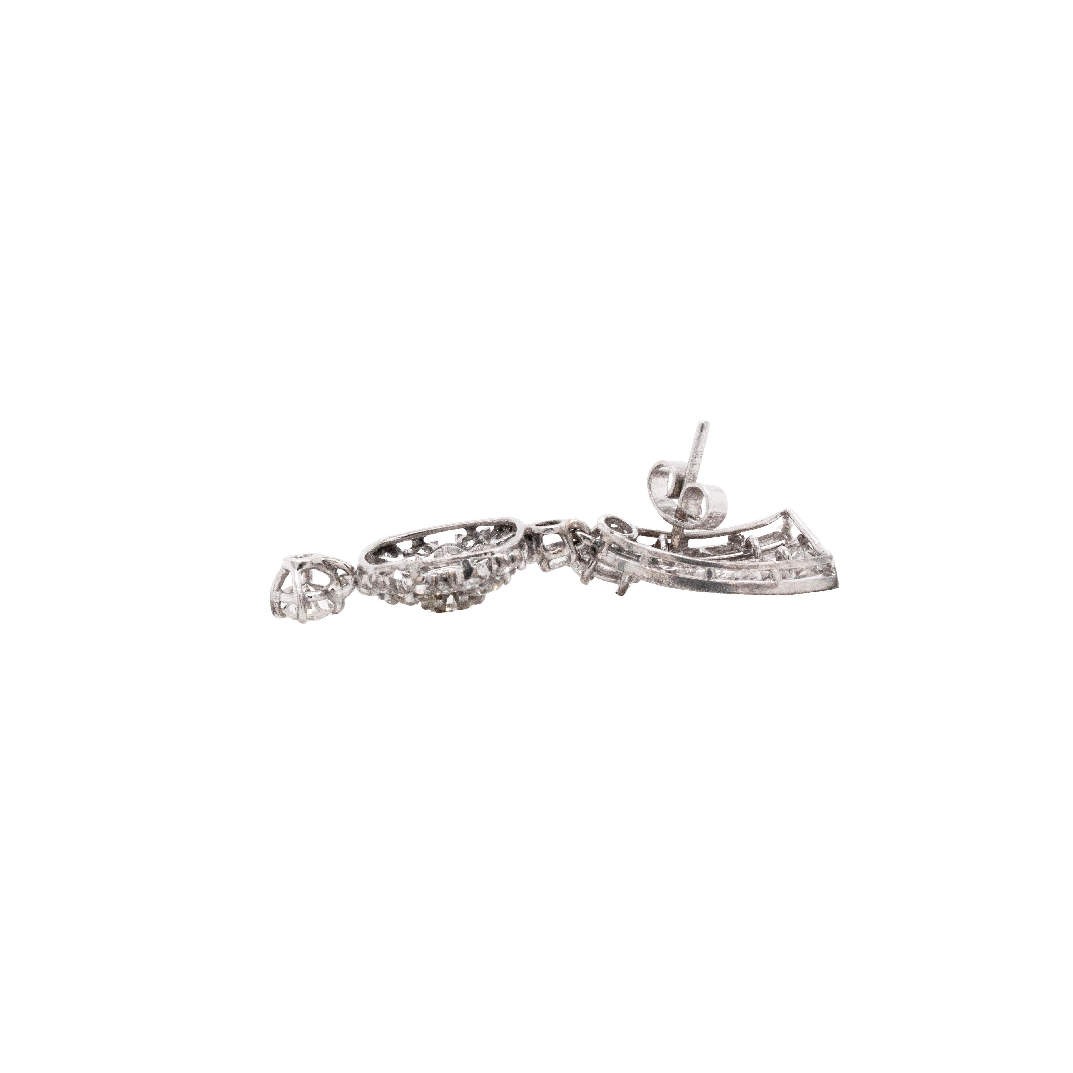 These stunning 1950s 18ct white gold and diamond earrings boast an estimated total of 3.70 carats of round brilliant cut, baguette and eight-cut diamonds across the pair. 

Beautifully crafted and set with a stud fixture, these earrings are designed
