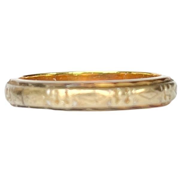 The engraving on this 18ct yellow and white gold band is beautiful. This band would make a gorgeous fancy wedding band or a beautiful every day wear ring. 

Ring Size: J or 4 3/4
Band Width: 3.5mm

Weight: 3g