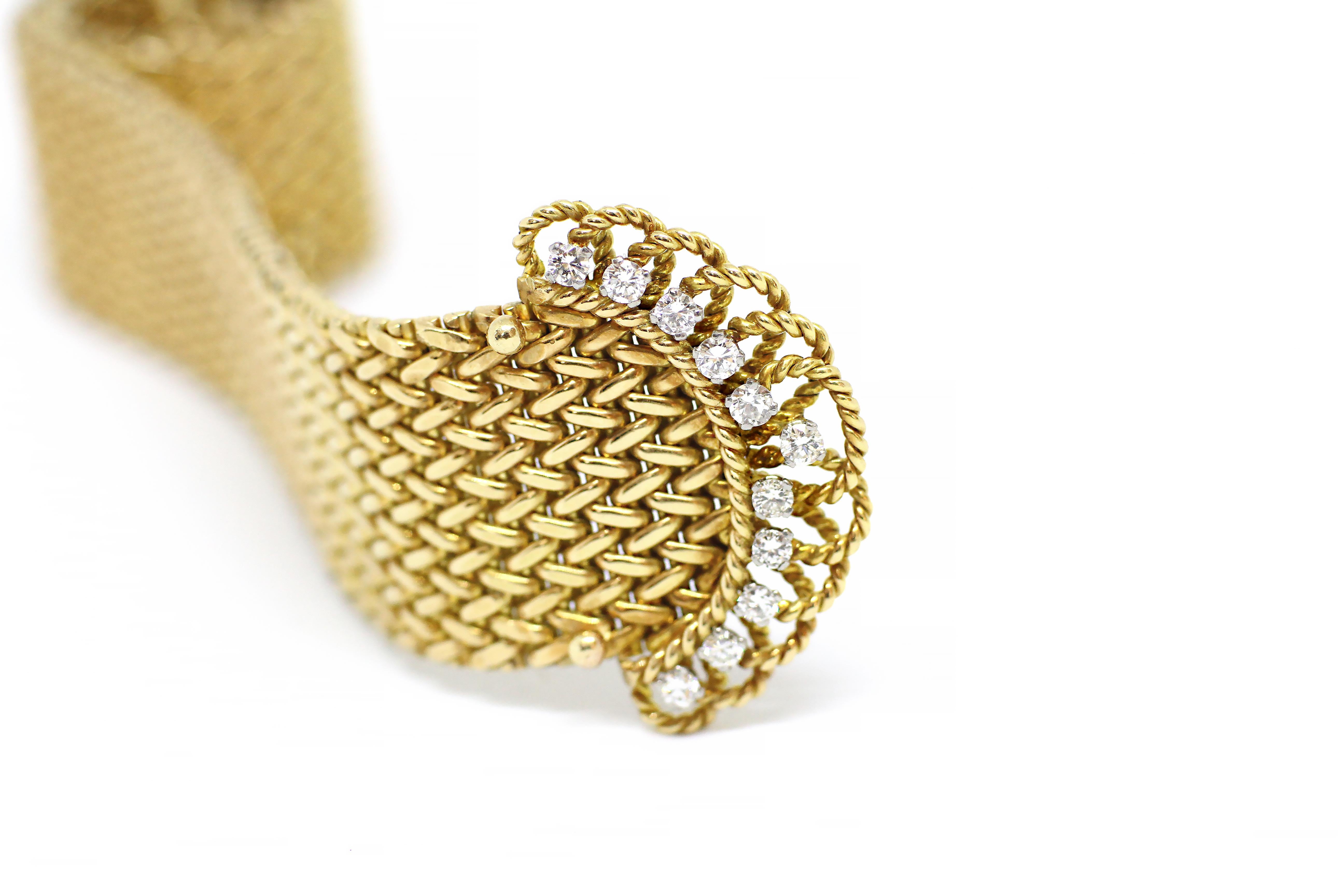 This unique bracelet features beautiful fine craftsmanship in its mesh detailing. Weighing a total of 134.1gr and measures 22.5cm in length and 2.4cm in width, this bracelet was created with a diamond set secure buckle fastening. The fastening is an