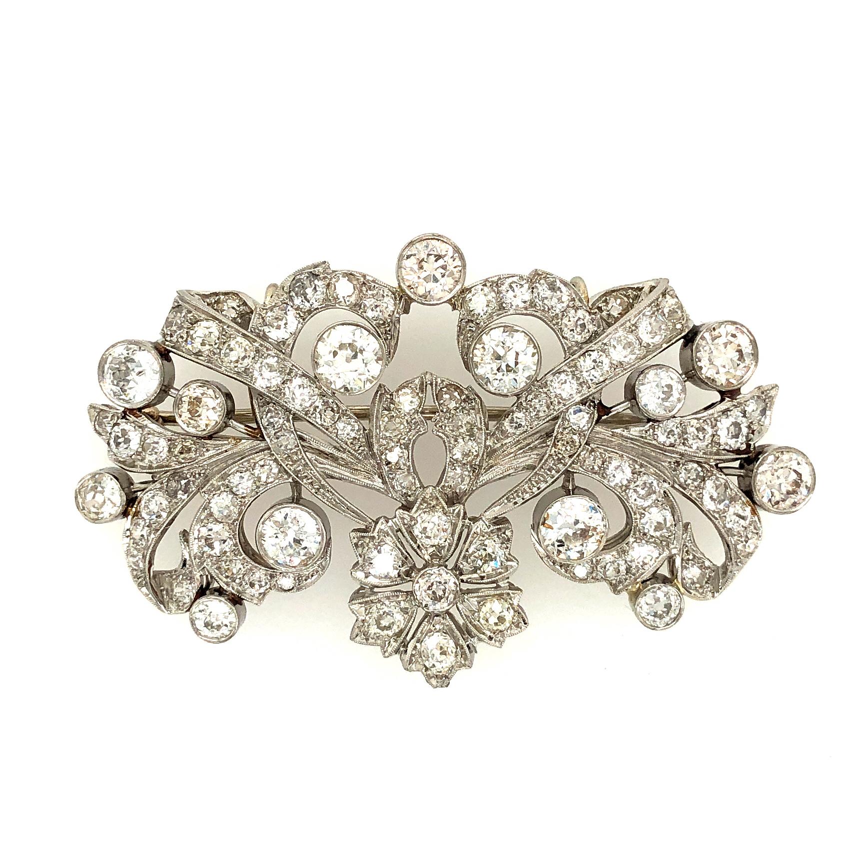 Offered here is an unique platinum diamond brooch. The brooch is in great condition for its age ( estimated 1960’s- 70’s ). All the diamonds in the brooch are old European cut and old mine cut G-H color Vs2-Si1 some I1 in clarity with an estimated