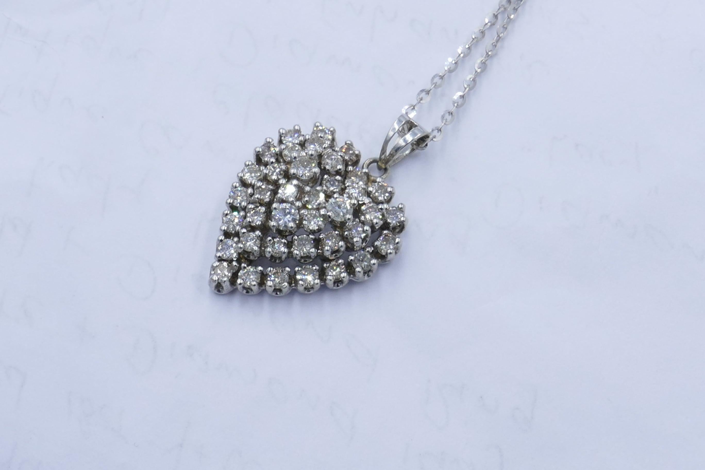  Beautiful Diamond Heart Pendant created in 18ct White Gold  & sitting on an 18 Carat White Gold Curb Link Chain.
The Pendant itself features 38 Round Brilliant Cut Diamonds 2.13 Carats in all, Colour G-L; Clarity SI1-I2; individually Claw Set.
The
