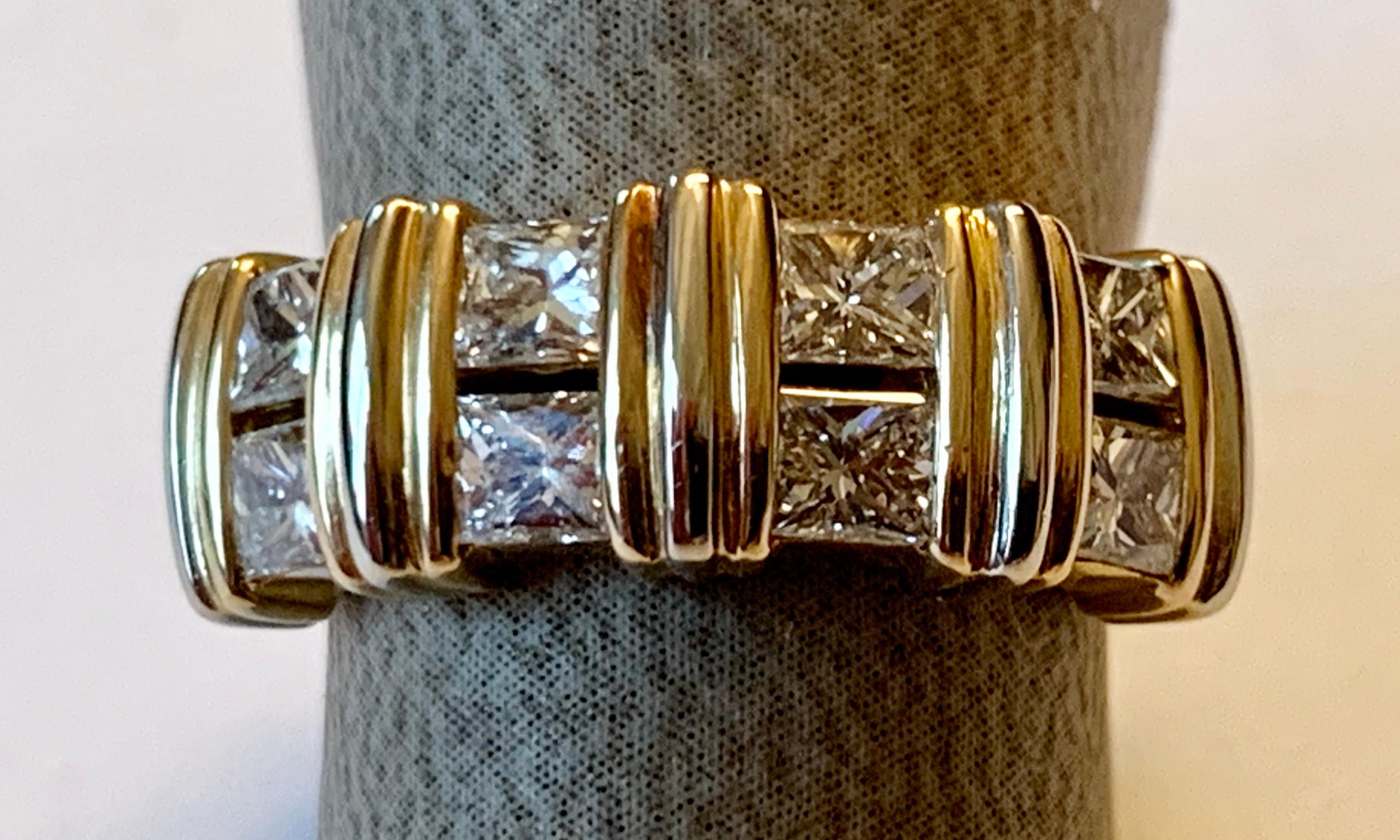 This lovely authentic Vintage band ring is by Cartier, crafted from 18k yellow gold with a polished finish features eight  princess cut Diamonds of approximately 0.90 ct, G color, vs clarity ,mounted at the front half of the band, each pair