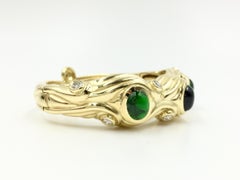 Vintage 18 Karat Carved Bangle with Diamonds and Green Tourmalines