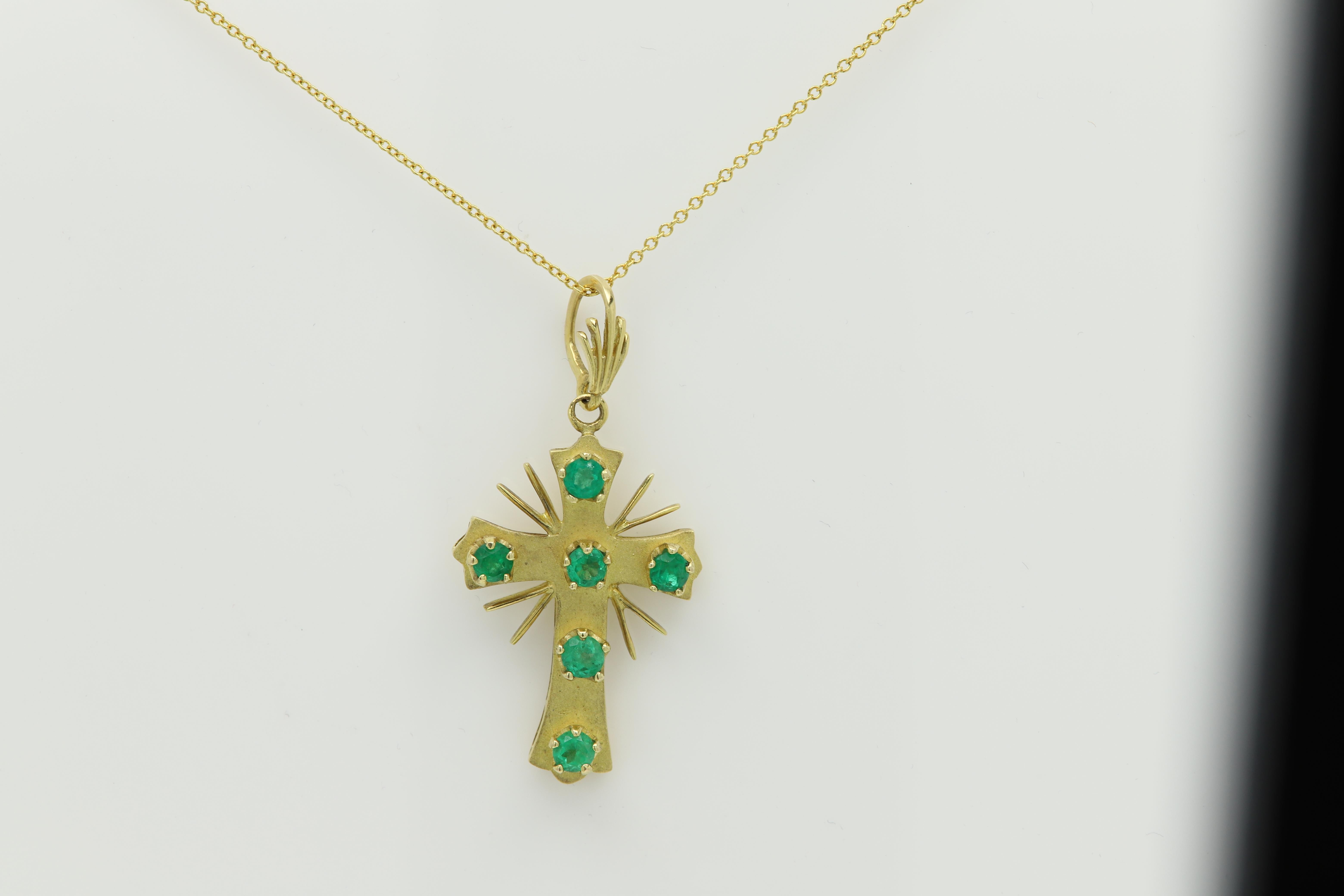 Vintage Emerald Cross Pendant399
pre-owned in very good condition
Natural Bright Green Emeralds 6 round stones (approx 3.5mm/ 0.20ct  each)
Total approx 1.20 carat Quality is AA nice green.
18k Yellow Gold approx 7.20 grams with the chain.
Chain is