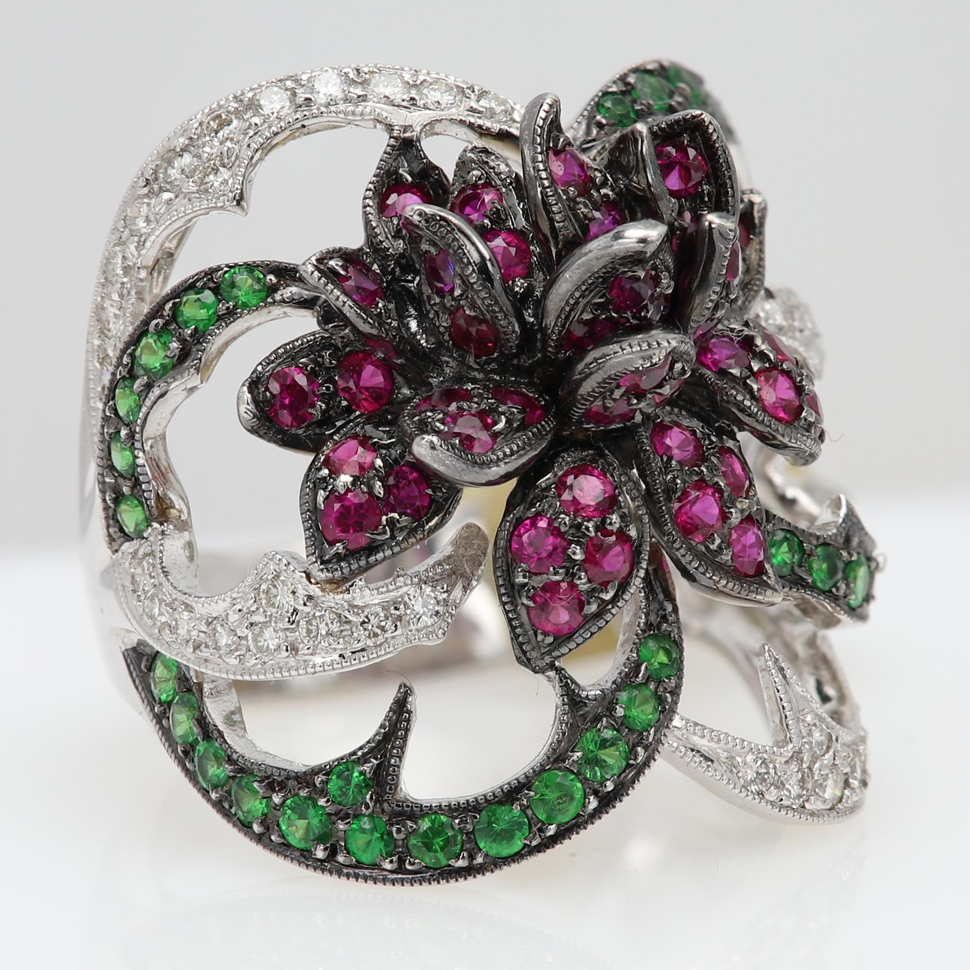 Vintage cocktail Ring
Pre-owned in excellent condition
18k white Gold weight approx: 14.0 grams
Natural Diamonds approx 0.40 ct
Natural Ruby approx 1.0 ct
Natural green Tsavorite approx 0.50 ct
finger size: 7.5
Overall size dimension is approx 25 x