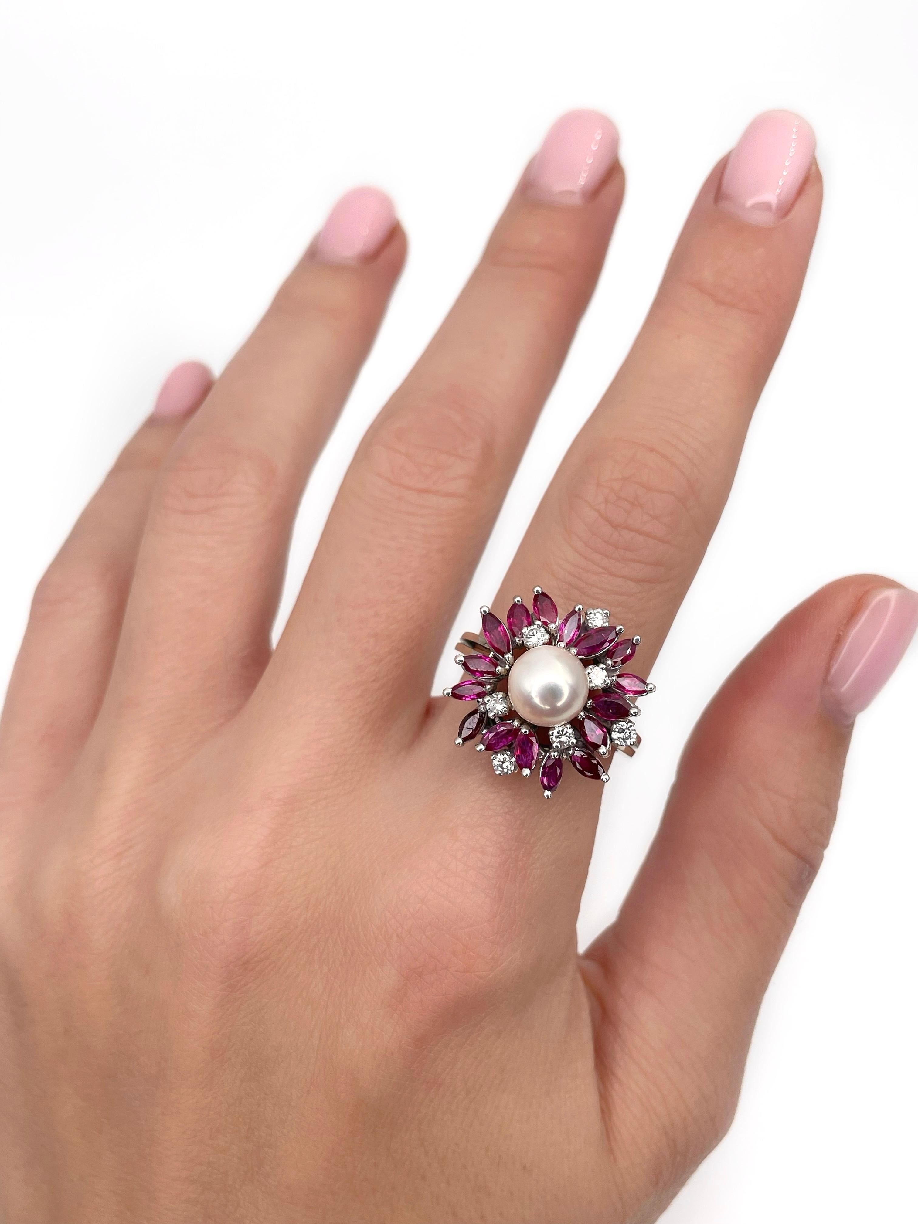 This is an asymmetrical design cocktail ring crafted in 18K gold. The piece features: 
- 1 cultured pearl
- 16 marquise cut rubies, TW 1.00ct, slpR 6/4, VS-SI
- 7 brilliant cut diamonds, TW 0.25ct, RW+/RW, VS

Weight: 8.12g
Size: 17 (US