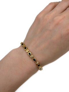 Vintage 18 Karat Gold 2.60 Carat Sapphire 0.22 Carat Diamond Tennis Bracelet