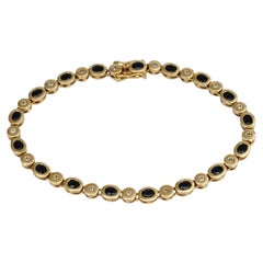 Vintage 18 Karat Gold 2.60 Carat Sapphire 0.22 Carat Diamond Tennis Bracelet