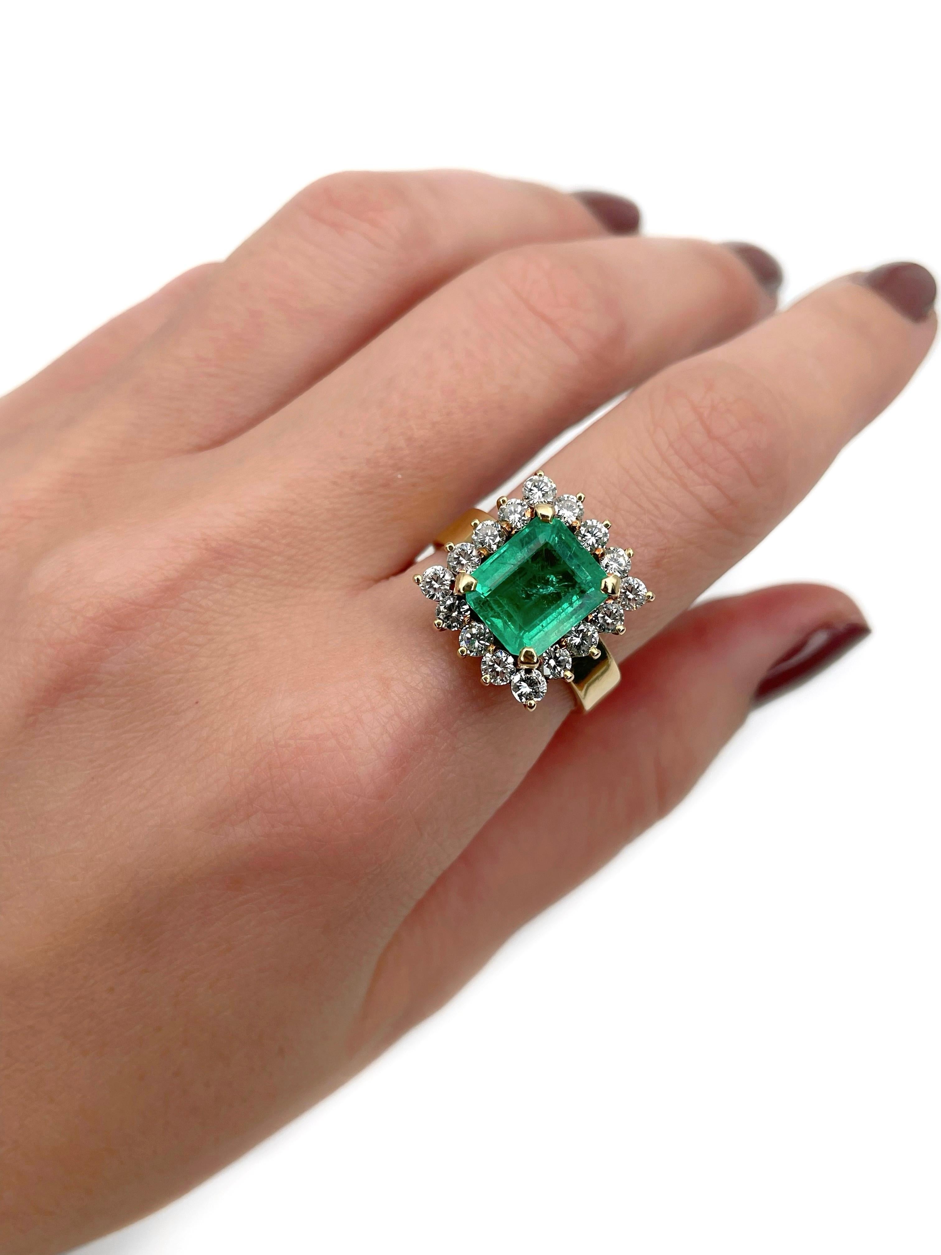 This is a vintage cluster ring crafted in 18K gold. Circa 1980. 

The piece features:
- 1 emerald, emerald cut, 3.00ct, vslbG 4/4, P2
- 16 diamonds, round brilliant cut, TW 1.20ct, RW+/W, VS-SI

Weight: 8.70g 
Size: 17.75 (US 7.5)

IMPORTANT: please