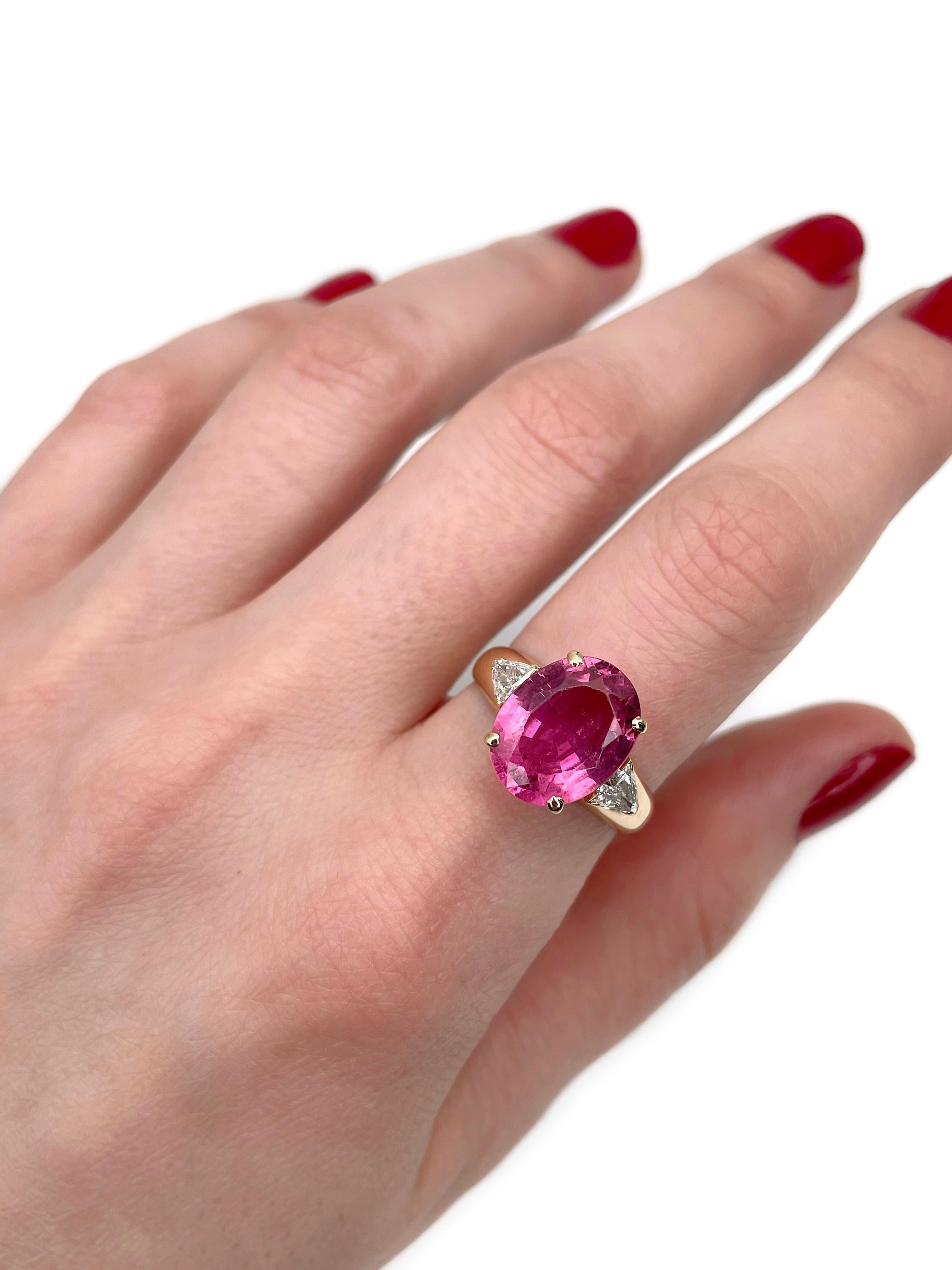 This is a vintage cocktail ring crafted in 18K yellow gold. Circa 1980. 

The piece features:
- 1 tourmaline (oval cut, 4.60ct, pink, PR-RP 4/4, SI
- 2 diamonds (triangle brilliant cut, TW 0.45ct, RW-W, SI)

Weight: 4.52g
Size: 17.75 (US