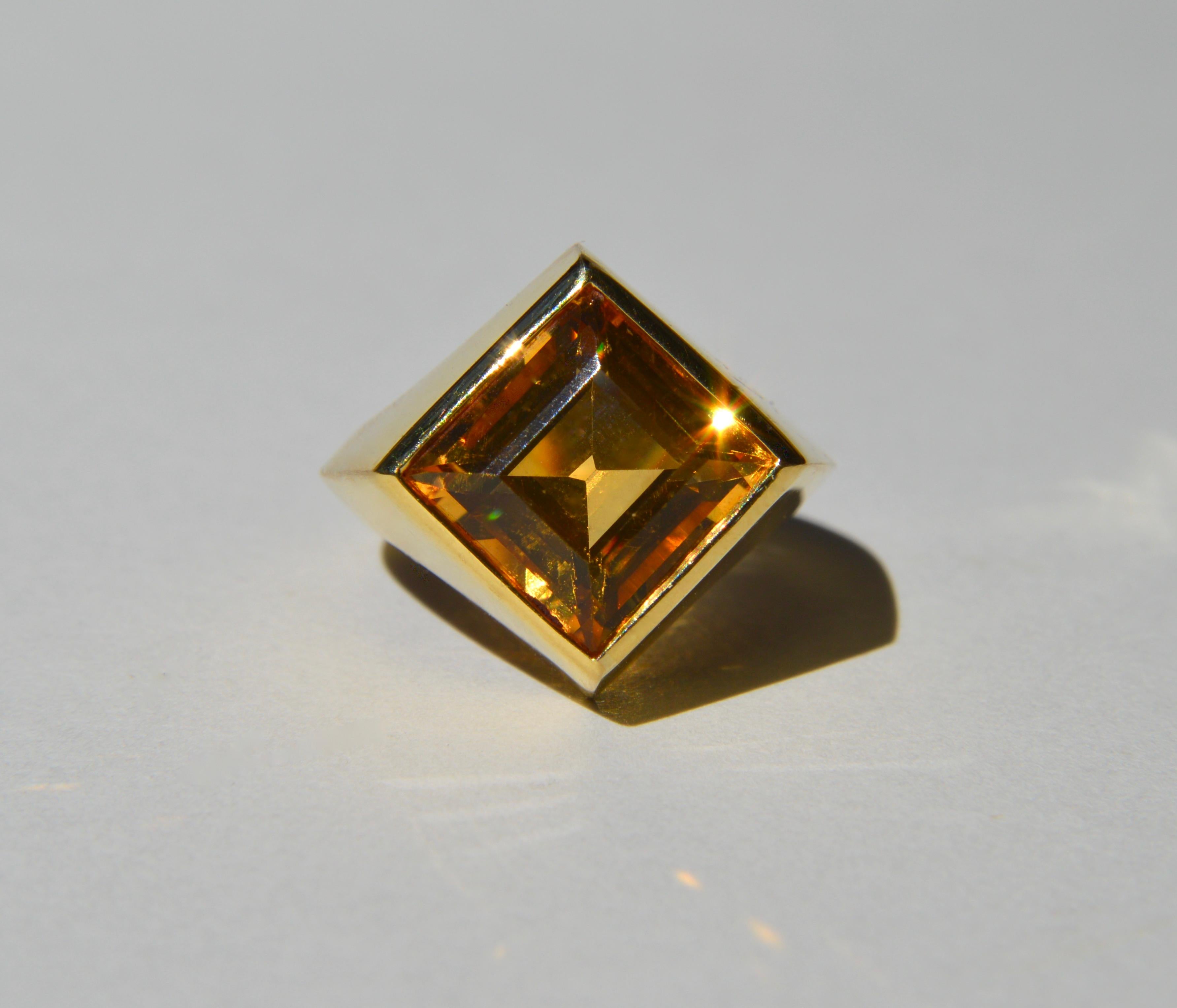 A magnificent vintage c1980s 18K yellow gold 5.62 carat genuine natural citrine princess cut cocktail ring. Size 6.25, can be resized by your local jeweler. In excellent condition. Marked and tested as 750 / 18K gold. Ring weighs 9.30 grams.

Called