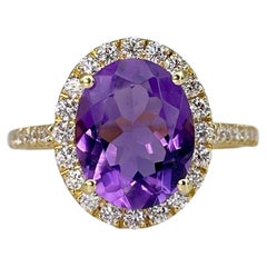 Retro 18 Karat Gold Amethyst 0.40 Carat Diamond Oval Cluster Ring