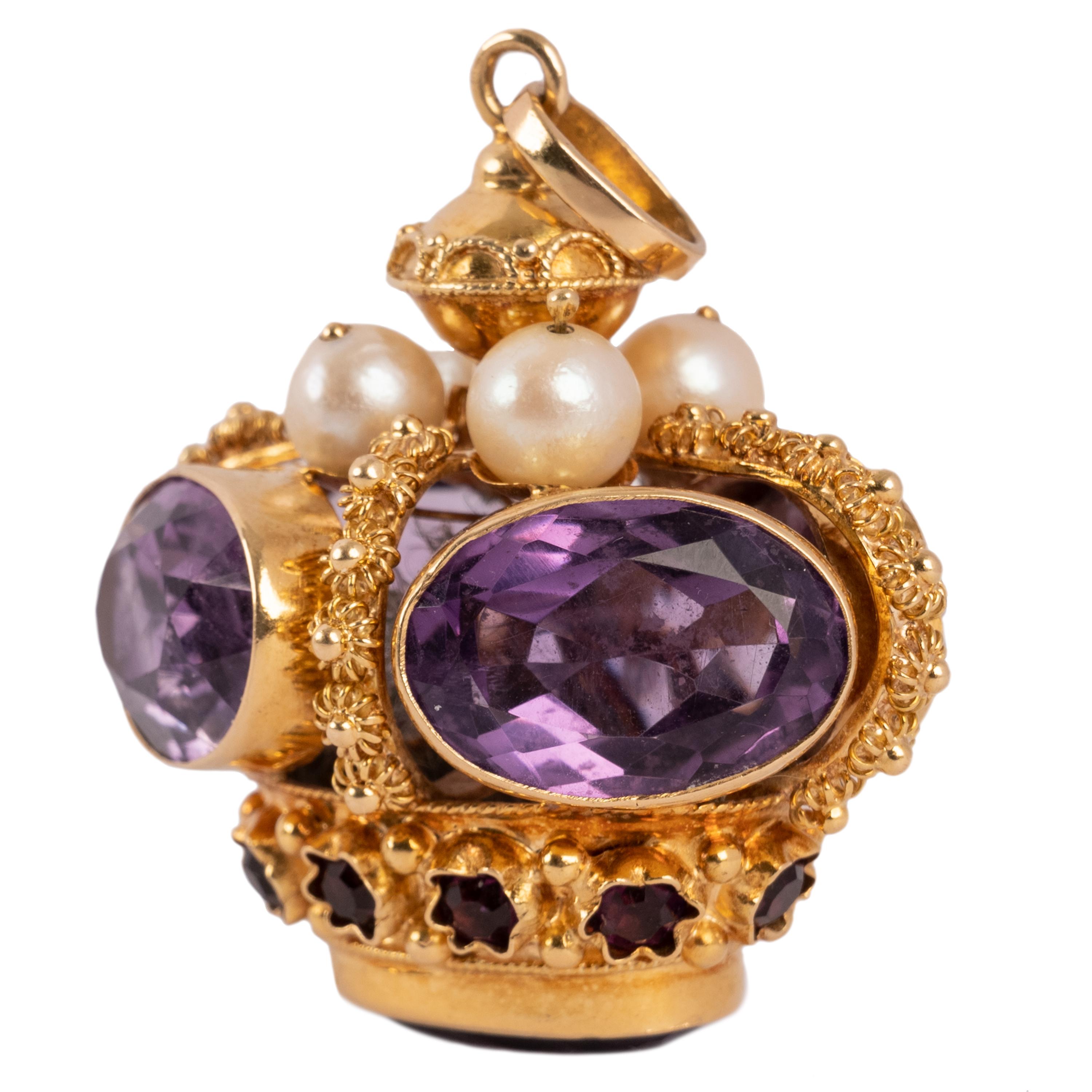 A fine and substantial 18k gold, amethyst and natural pearl pendant.
The pendant modelled in gold as a crown is of the very highest quality, the gem is set with five imposing oval faceted amethysts, each around 7 carats in size and with a gallery of