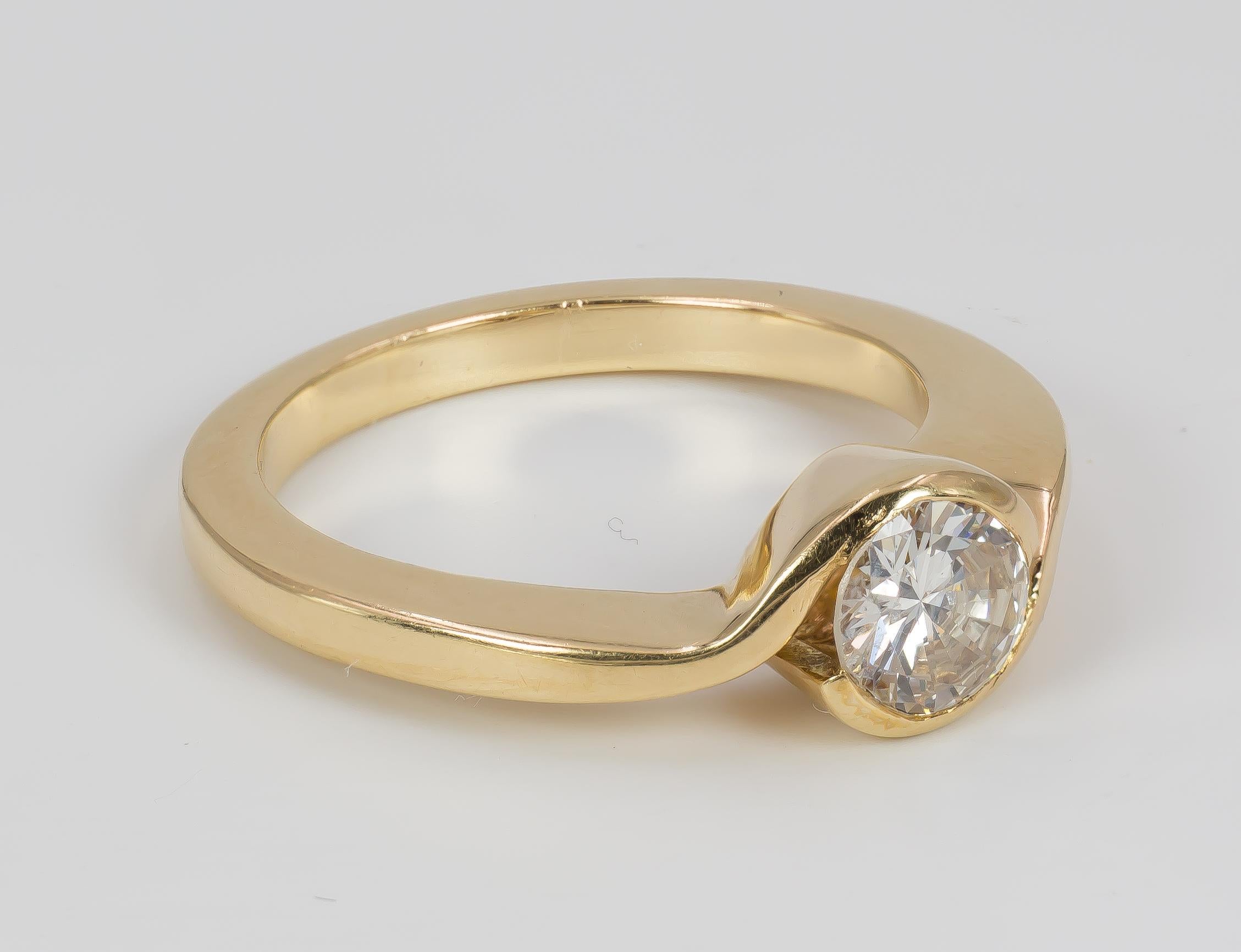 This particular solitaire ring is crafted in 18K gold throughout, and it is set with a central 0.7ct round cut diamond. The ring dates from the 1970s.

MATERIALS
18K gold and one 0.7ct round cut diamond

RING SIZE
6½ US (resizable)

WEIGHT
5.5 g