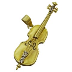 Retro 18 karat Gold and Diamond Cello Pendant