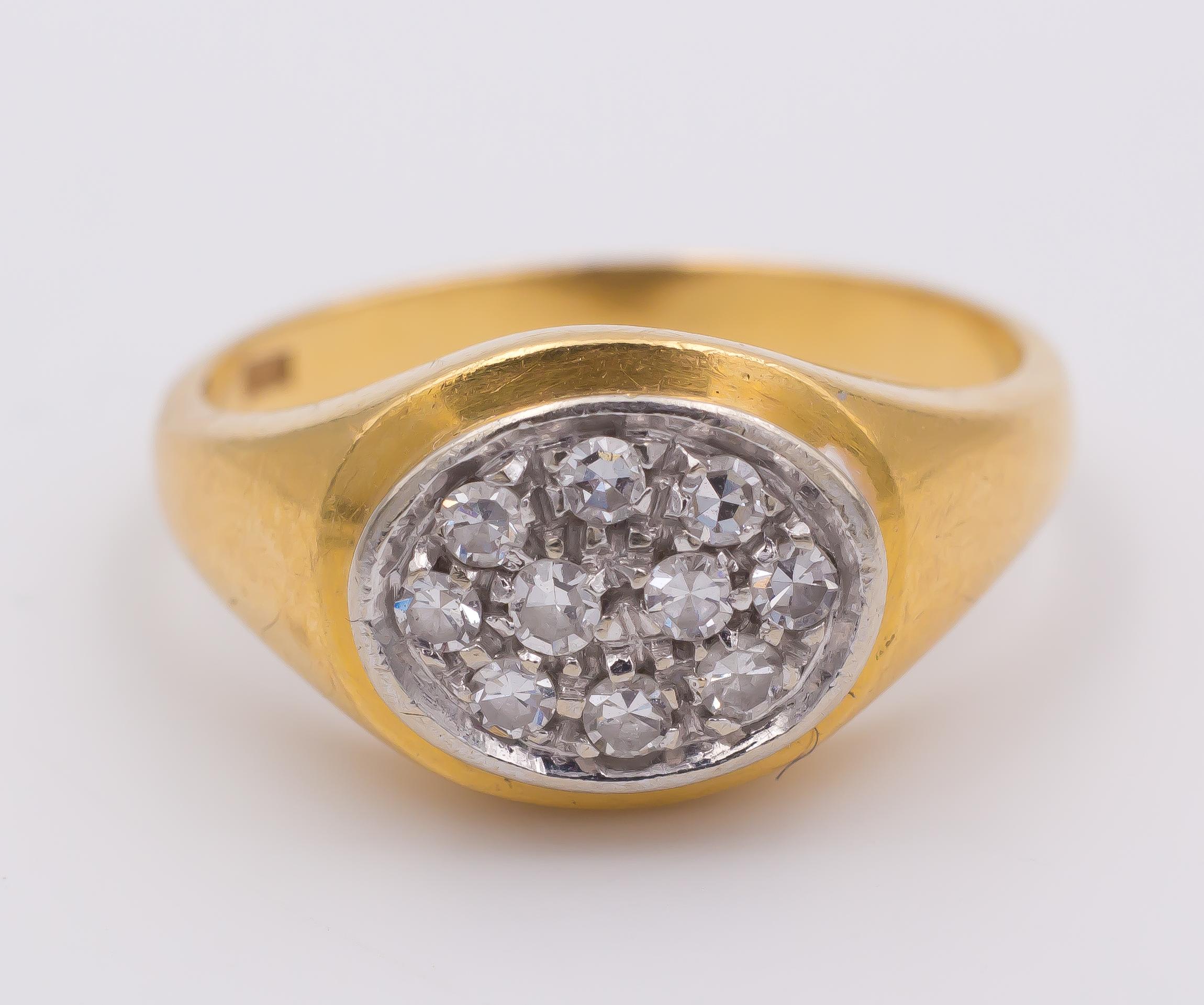 A simple but elegant vintage ring: the head is set with ten huit-huit cut diamonds and the ring is crafted in 18K gold throughout. 
Its sleek profile and its shape make this ring perfect for both a woman and a man's hand.  

MATERIALS
18K gold and