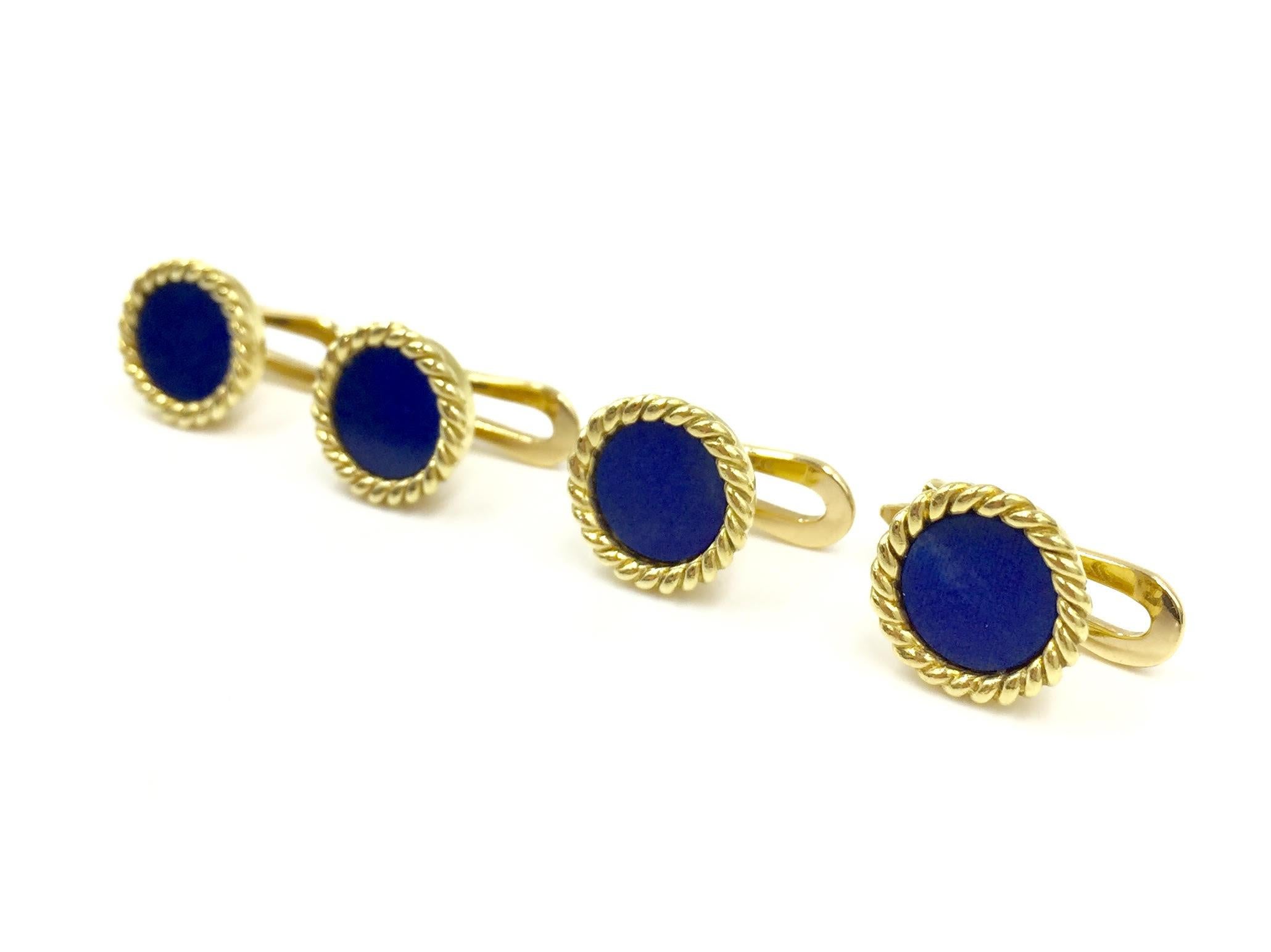 This set of four vintage signed Verdura shirt studs are an incredible find for any black tie affair. Verdura is known for their timeless and elegant pieces with attention to detail. Natural blue lapis is encased in 18k yellow gold rope design