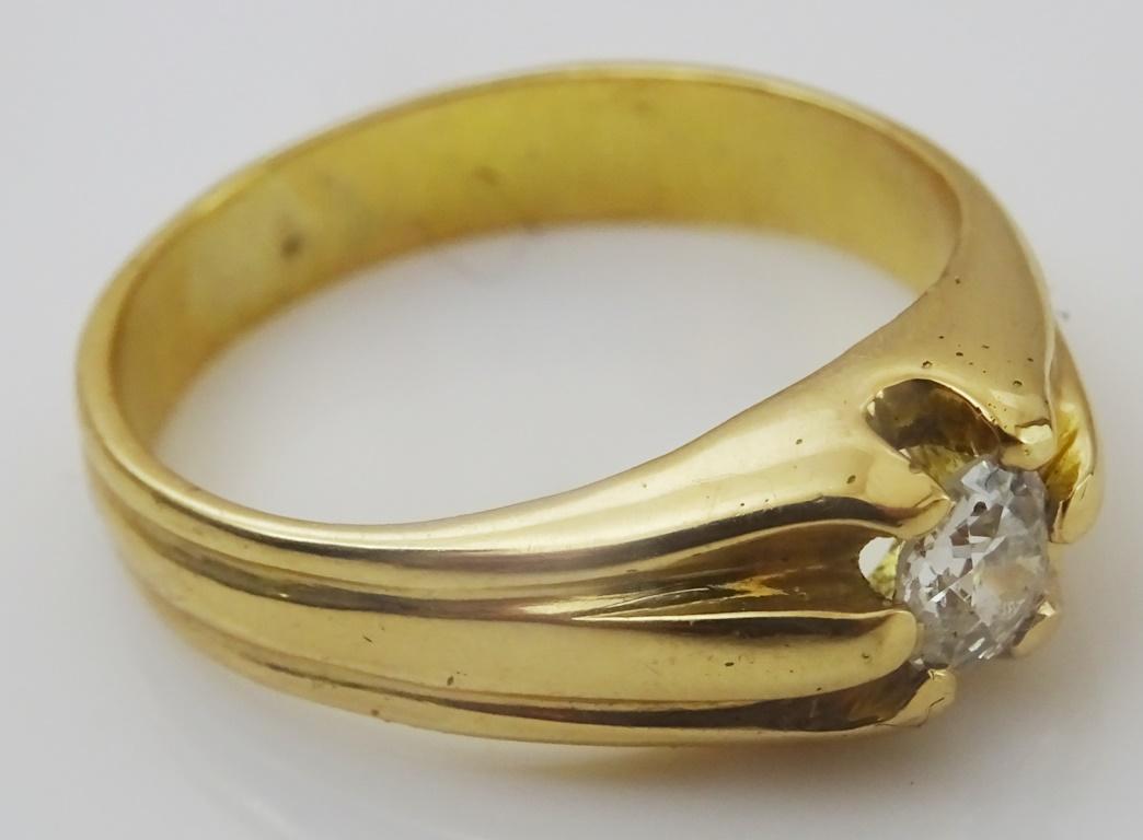  These type of Ring that comes from Iraq and neighboring countries is one of the many variations worn by both men and women in these areas.
Made in acid tested 18 karat Gold.
It is set with a 5.5 mm roundish old cut Diamond of good color and quality