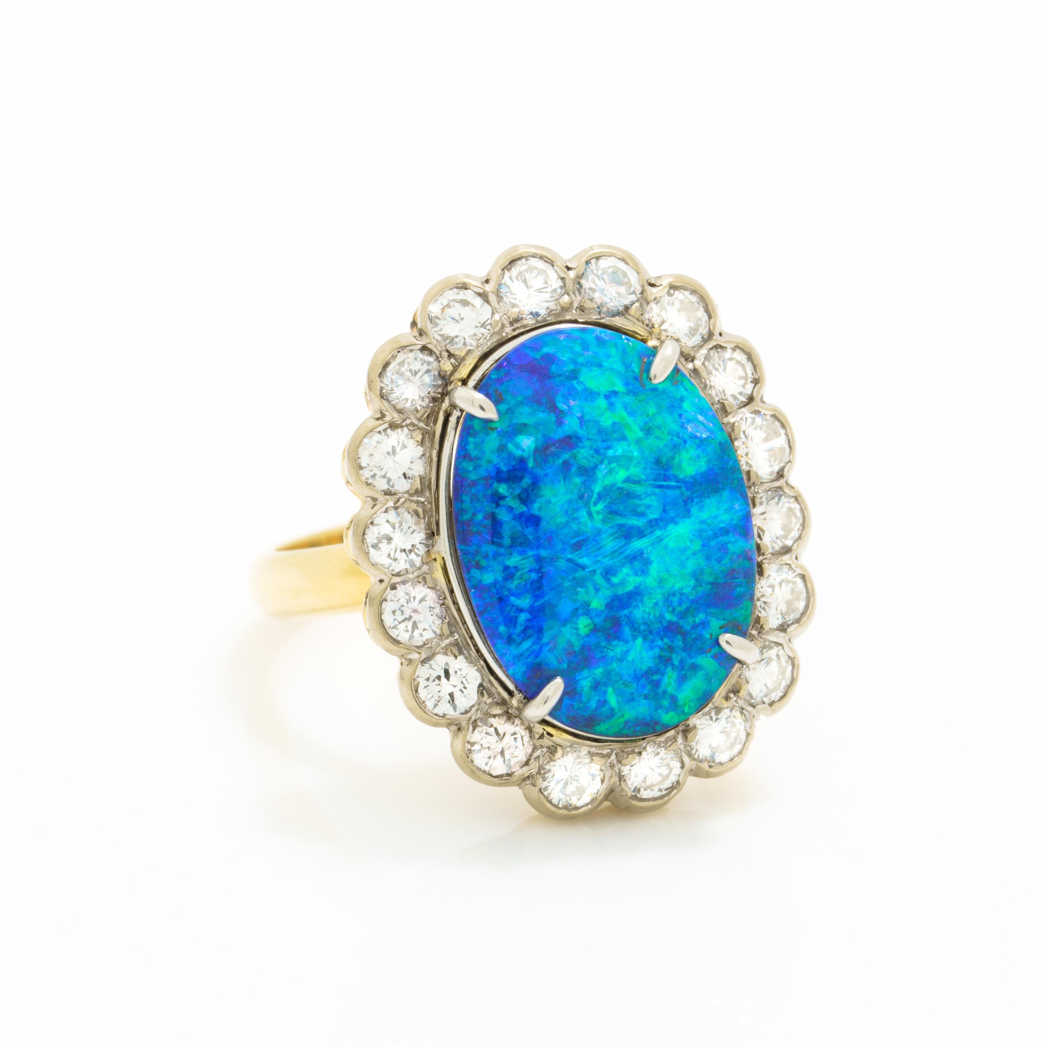 Vintage 18 Karat Gold and Platinum 5.0 Carat Black Opal and 1.25 Carats Diamond Halo Ring
c.1960s
Size 6.5 - sizable
7.7 grams
This is the one YOU have always been seeking
Insanely bright and fiery Opal
very good condition. stunning opal. bright