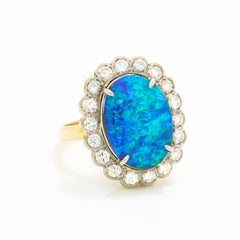 Vintage 18 Karat Gold and Platinum 5.0 Carat Black Opal and Diamond Halo Ring