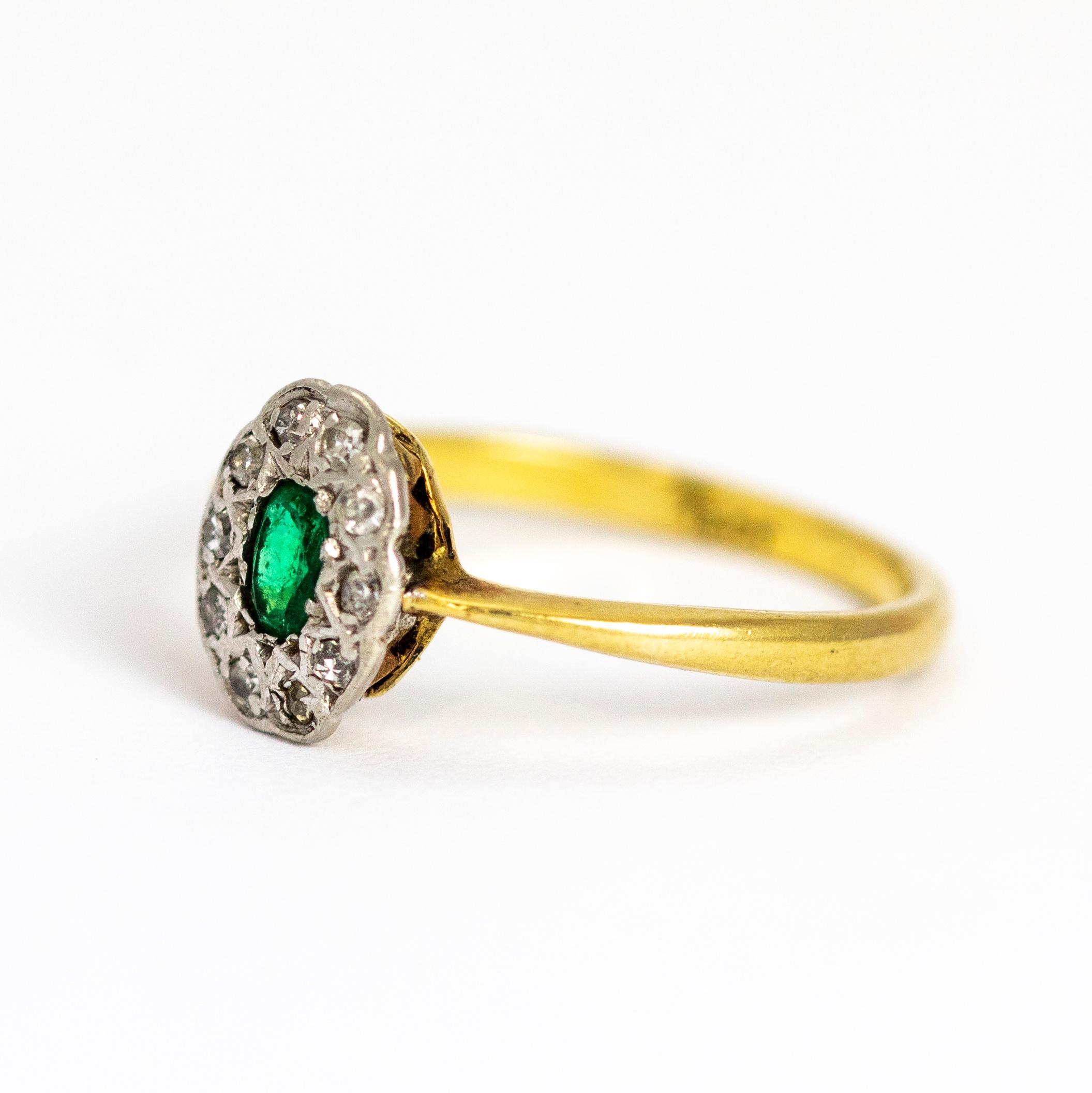 A delightful vintage cluster ring centrally set with a beautiful oval-cut green emerald, surrounded by a halo of ten round diamonds. The stones are set in white gold to complement their colour, band modelled in 18 karat yellow gold.

Ring Size: UK