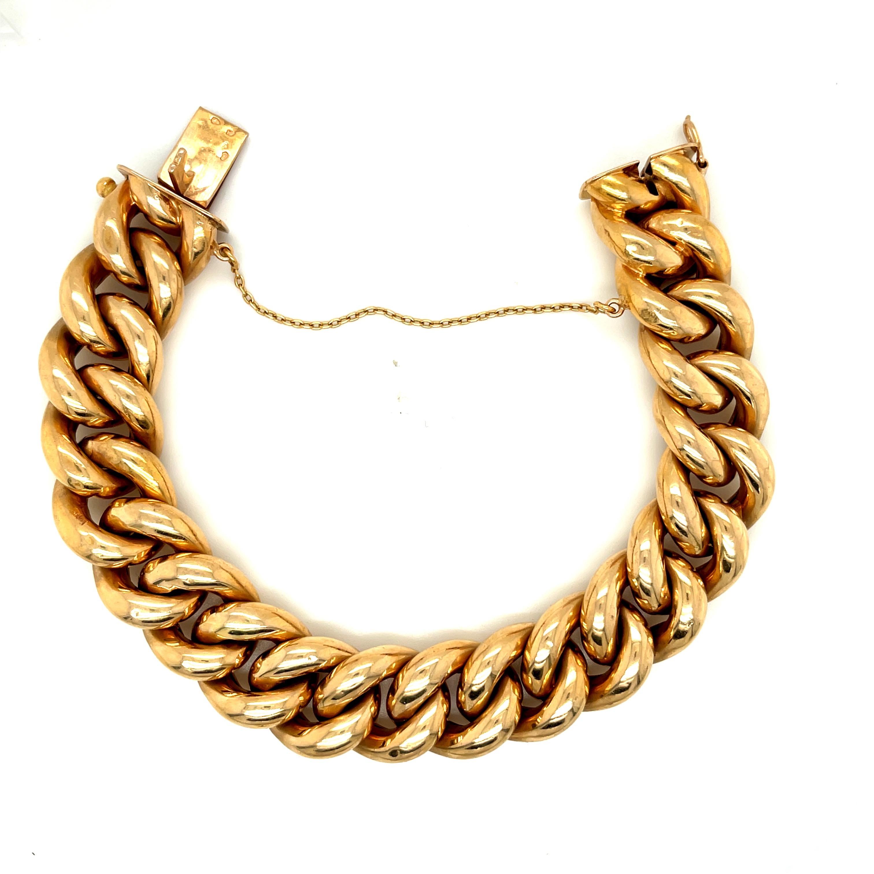Classic vintage 18k yellow gold French curblink bracelet circa 1960. This wearable link bracelet is hollow form and has a nice feel to it. The bracelet has a tongue clasp and the bracelet has French hallmarks. There is a safety chain, The bracelet