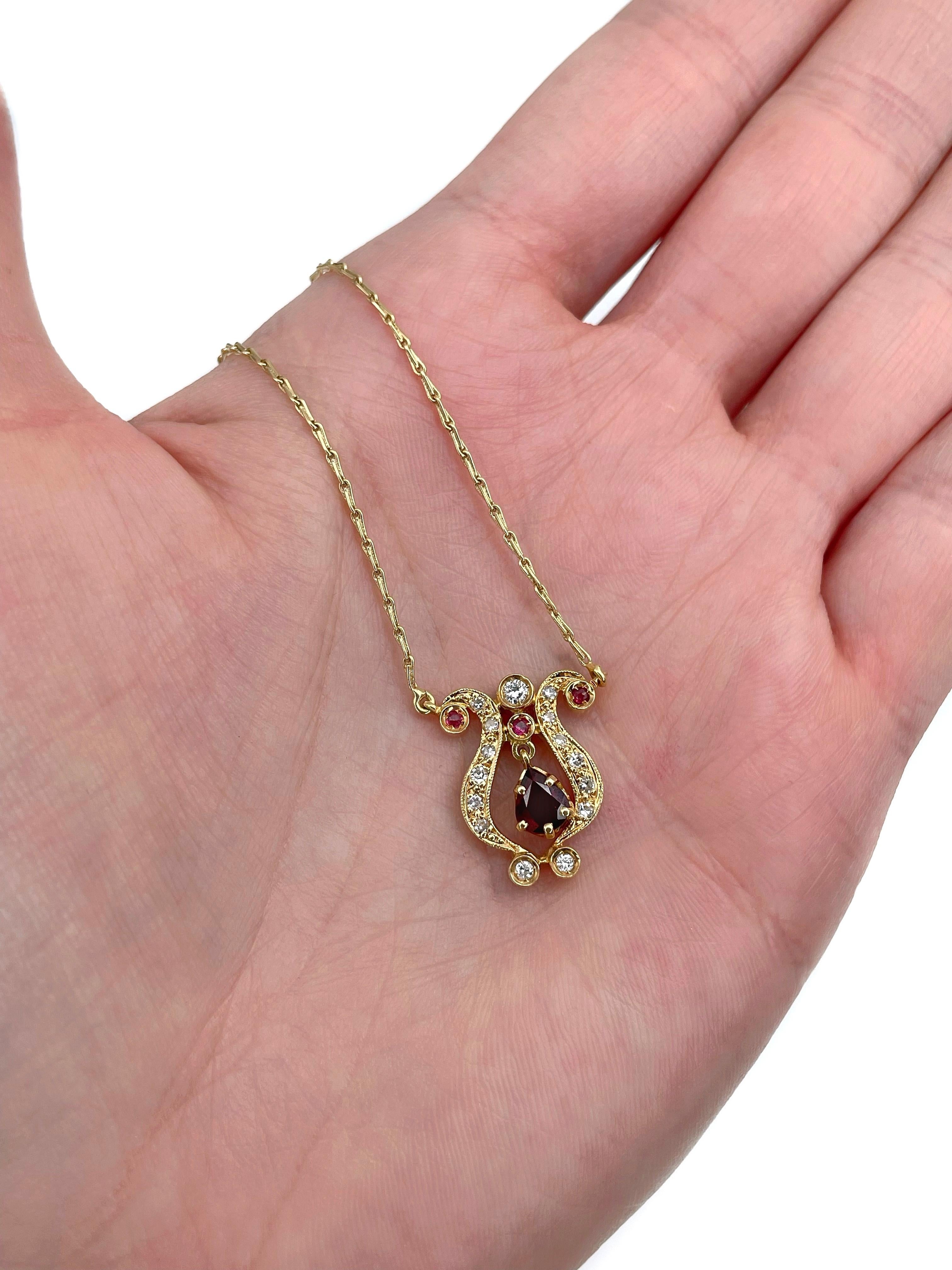 This is a vintage pendant chain necklace crafted in 18K yellow gold. Circa 1960. 

 The piece features:
- 1 garnet, pear cut
- 3 rubies, round cut, TW 0.10ct, slpR 5/4, SI
- 12 diamonds, RBC -17/57, TW 0.24ct, RW-W, VS-SI

Weight: 5.55g
Pendant