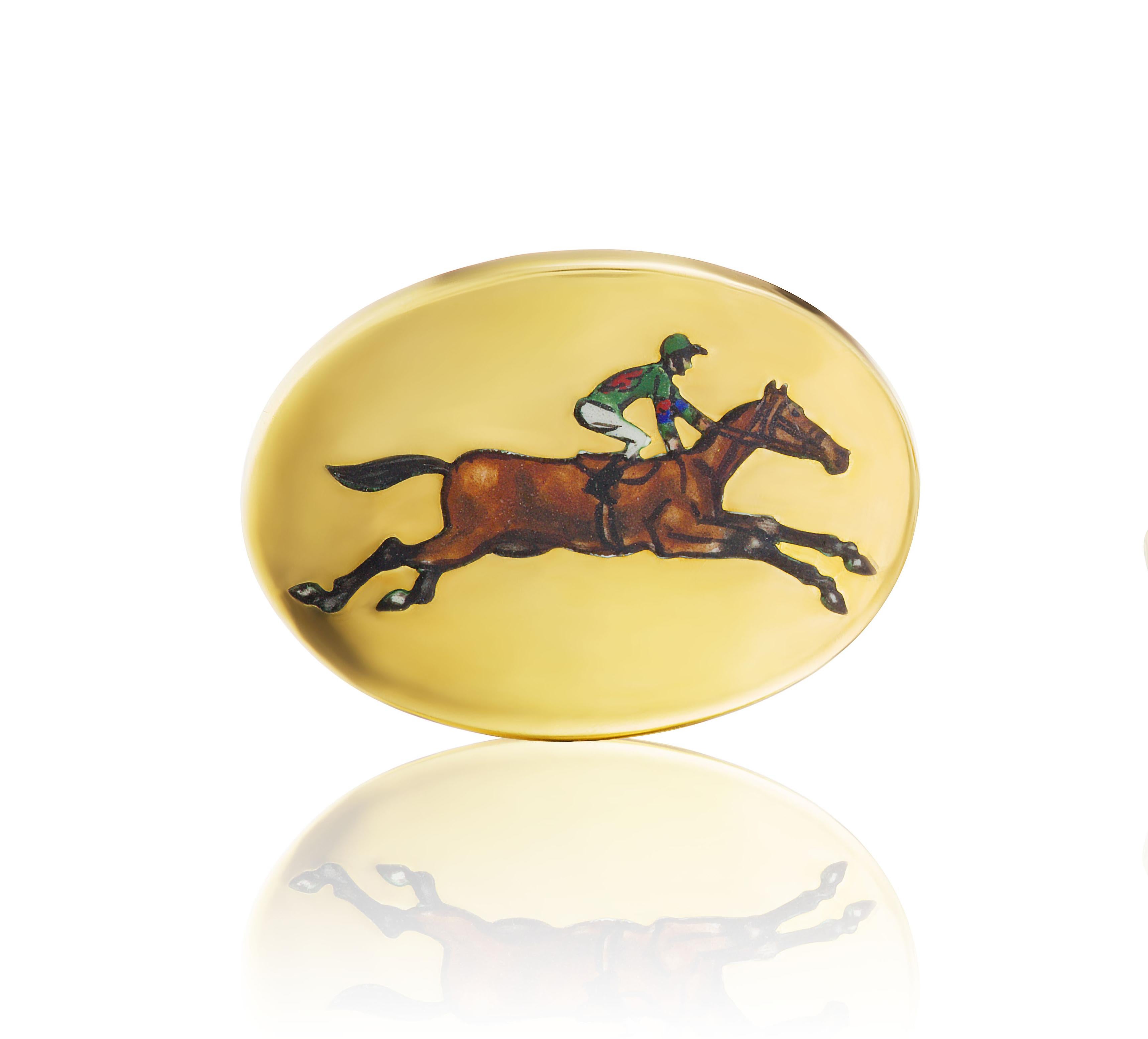Vintage 18K gold cufflinks feature an enamel horse and rider mid-jump in fantastic detail.

Stamped D&F