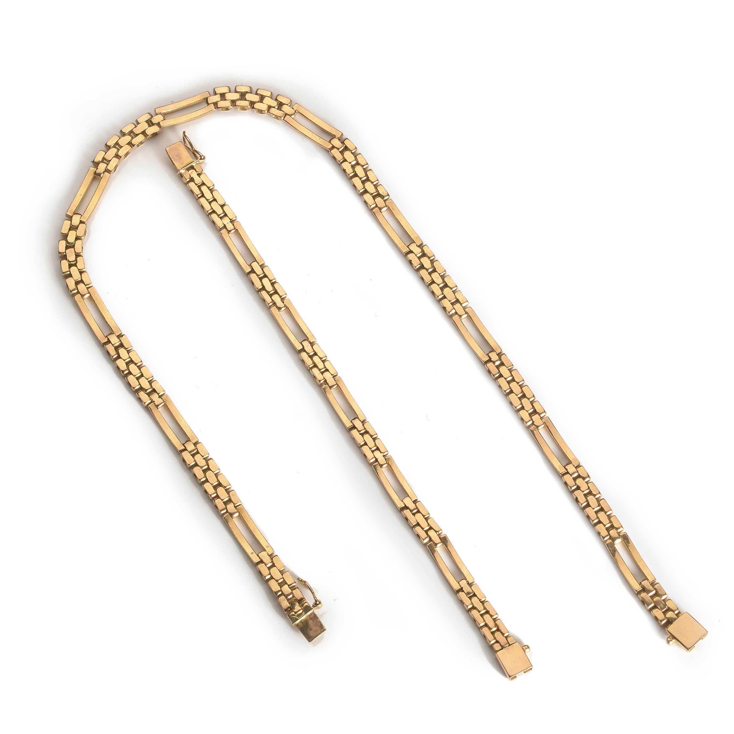 A matching gold suite consisting of a necklace and bracelet, made up of brick-links and elongated open panel links, mounted in 18ct yellow gold. Of European origin, circa 1980.

Bracelet length: 6 ¾