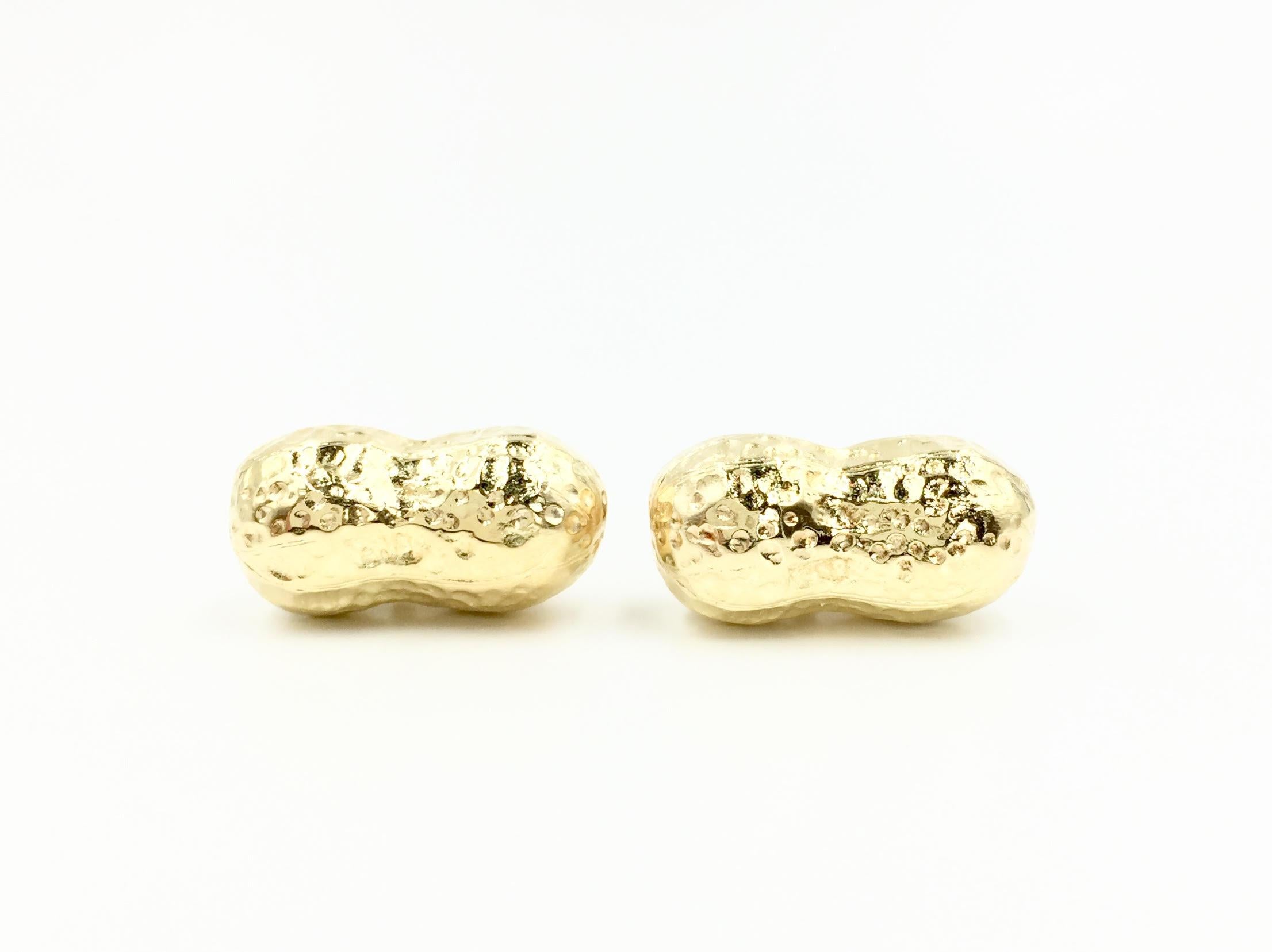 Designed by Louis Tamis & Sons in 1998, these hand crafted solid 18 karat yellow gold peanut cuff links are fun while making a subtle statement. Incredible design, they truly look like actual peanuts dipped in gold. Polished hinge style
