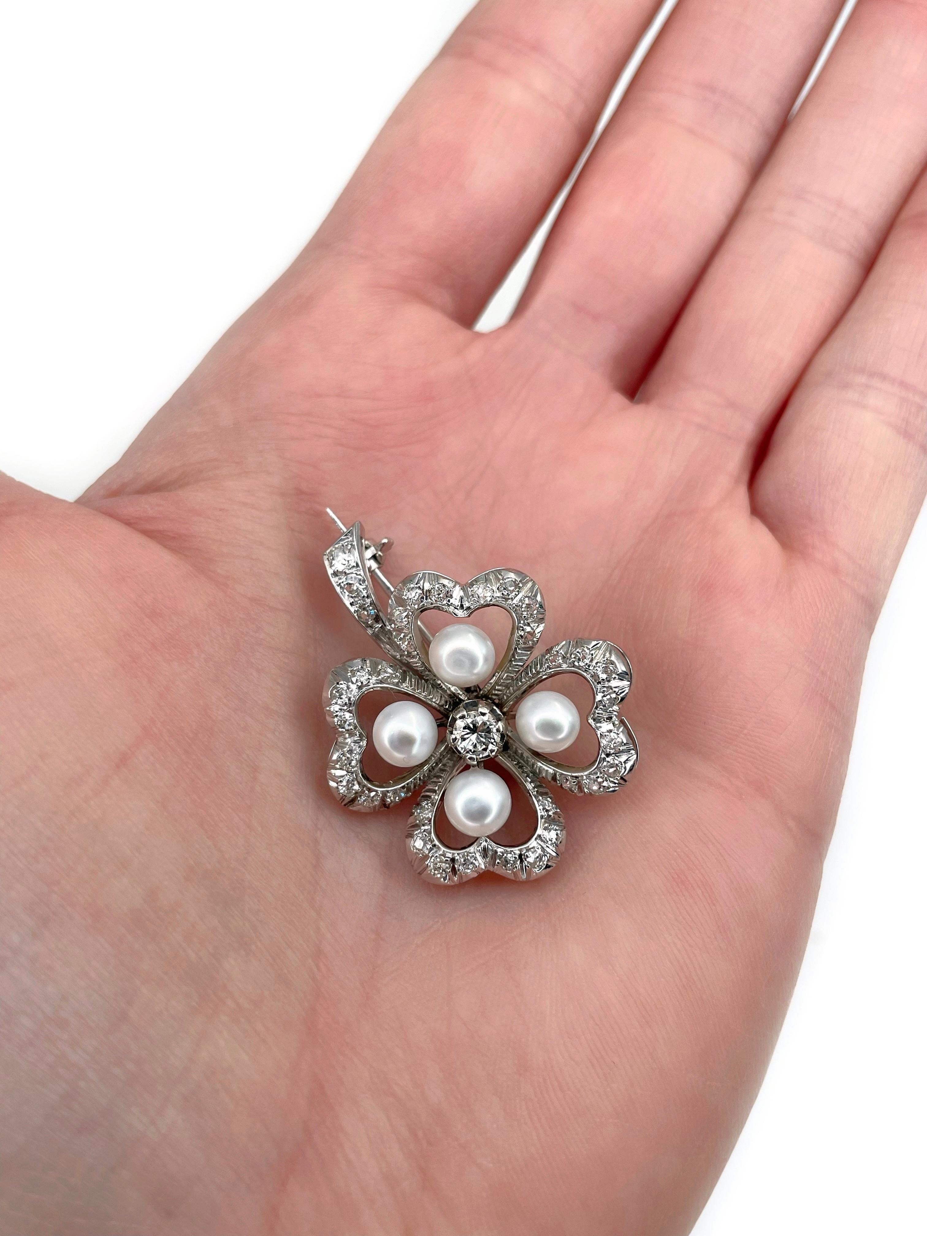 This is a lovely vintage four leaf clover pin brooch. It is crafted in 18K white gold. Circa 1950.

The piece features:
- 4 cultured pearls 
- 1 diamond, round brilliant cut, 0.21ct, RW-W, SI1
- 35 diamonds, old cut (1pc. RBC-17), TW 0.65ct, RW+/RW,