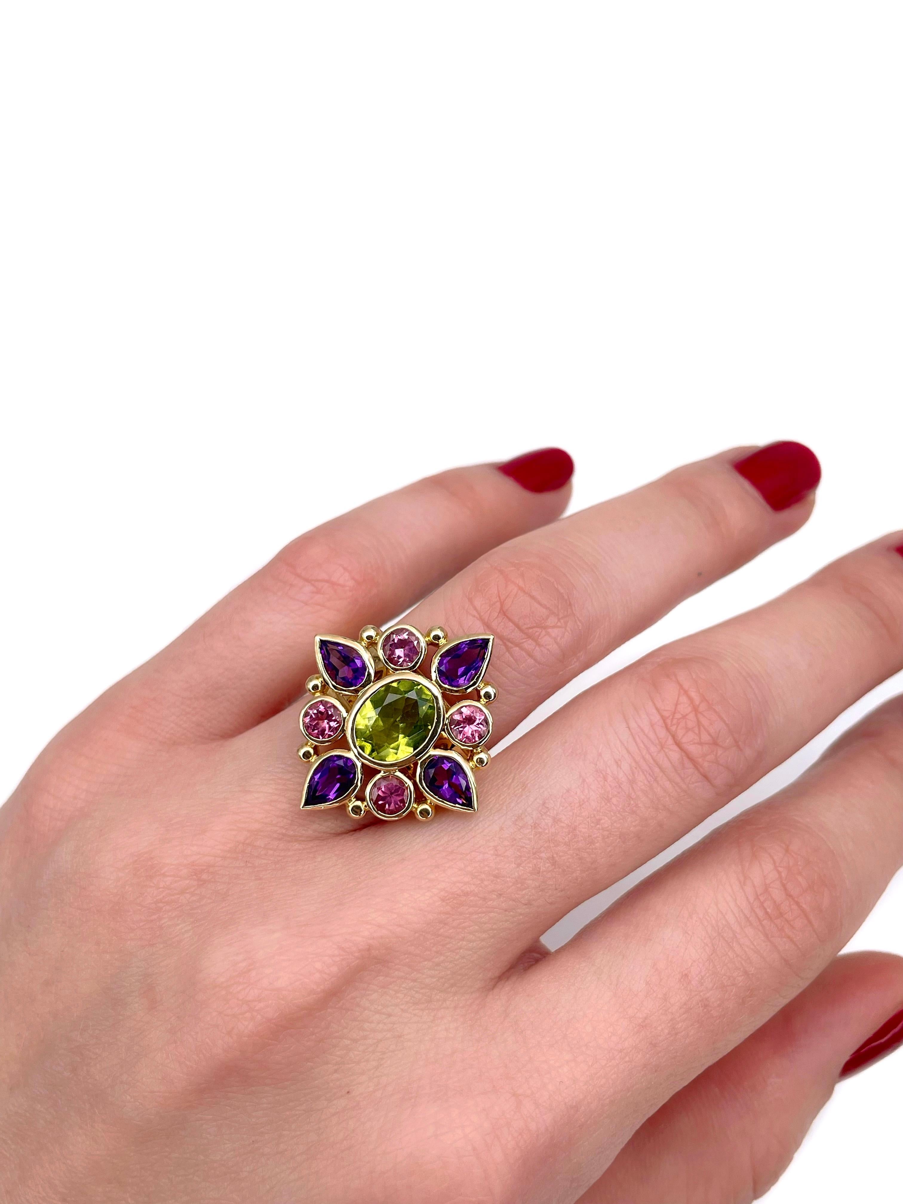 This is a vintage colourful cocktail ring crafted in 18K yellow gold. Circa 1980. 

The piece features:
- 1 peridot, oval cut
- 4 amethysts, pear cut
- 4 tourmalines, round cut

Weight: 13.54g
Size: 16.5 (US 6)

IMPORTANT: please ask about the