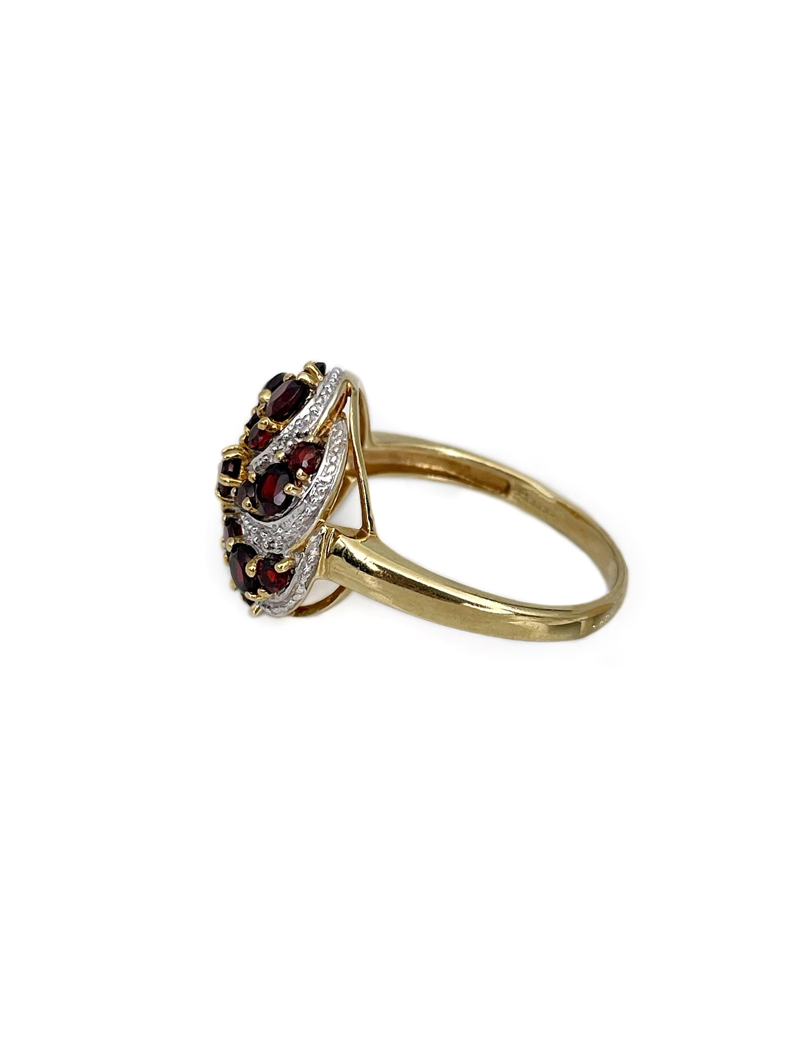 This is a vintage cocktail ring crafted in 18K yellow gold. The piece features 19 round red garnets and 6 round diamonds (17 facets, 0.03ct, W-STW, SI-P1). 

Weight: 5.74g
Size: 17.25 (US 6.75)

IMPORTANT: please ask about the possibility to resize