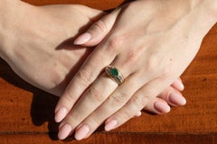 Vintage 18-karat gold ring with emerald and diamonds
