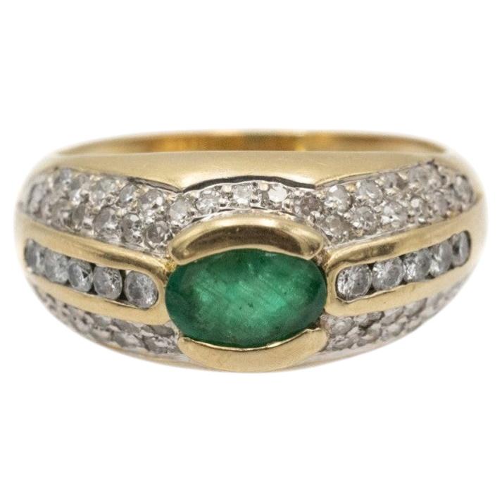 Anillo vintage de oro de 18 quilates con esmeralda y diamantes en venta