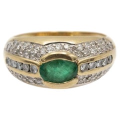 Vintage 18-karat gold ring with emerald and diamonds