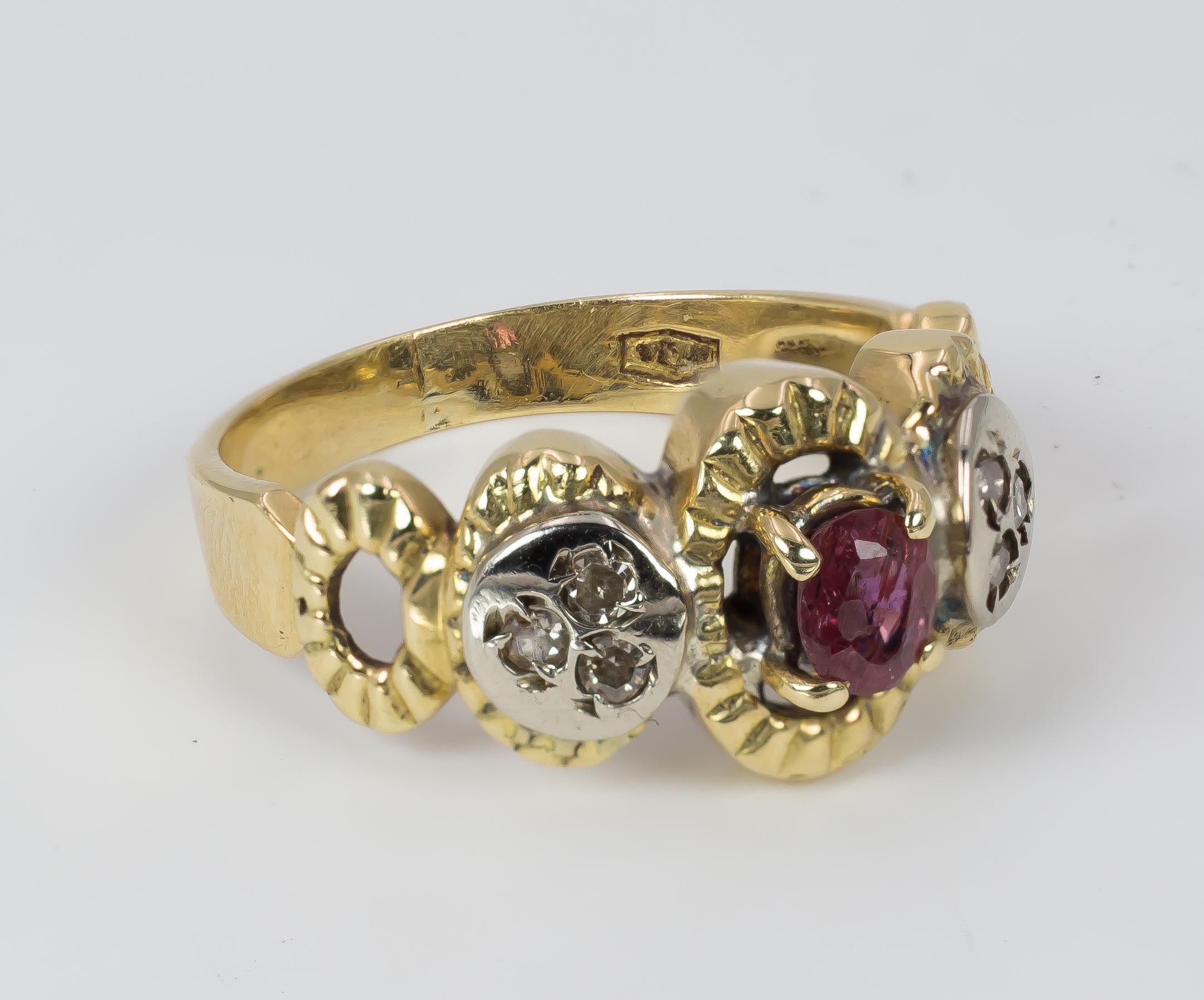 This beautiful vintage ring, dating from the 1970s, is set with a central ruby, flanked on either side by three rose cut diamonds. The ring is crafted in 18K gold throughout, and has a beautiful openwork to the shoulders. 

MATERIALS
18K gold, ruby