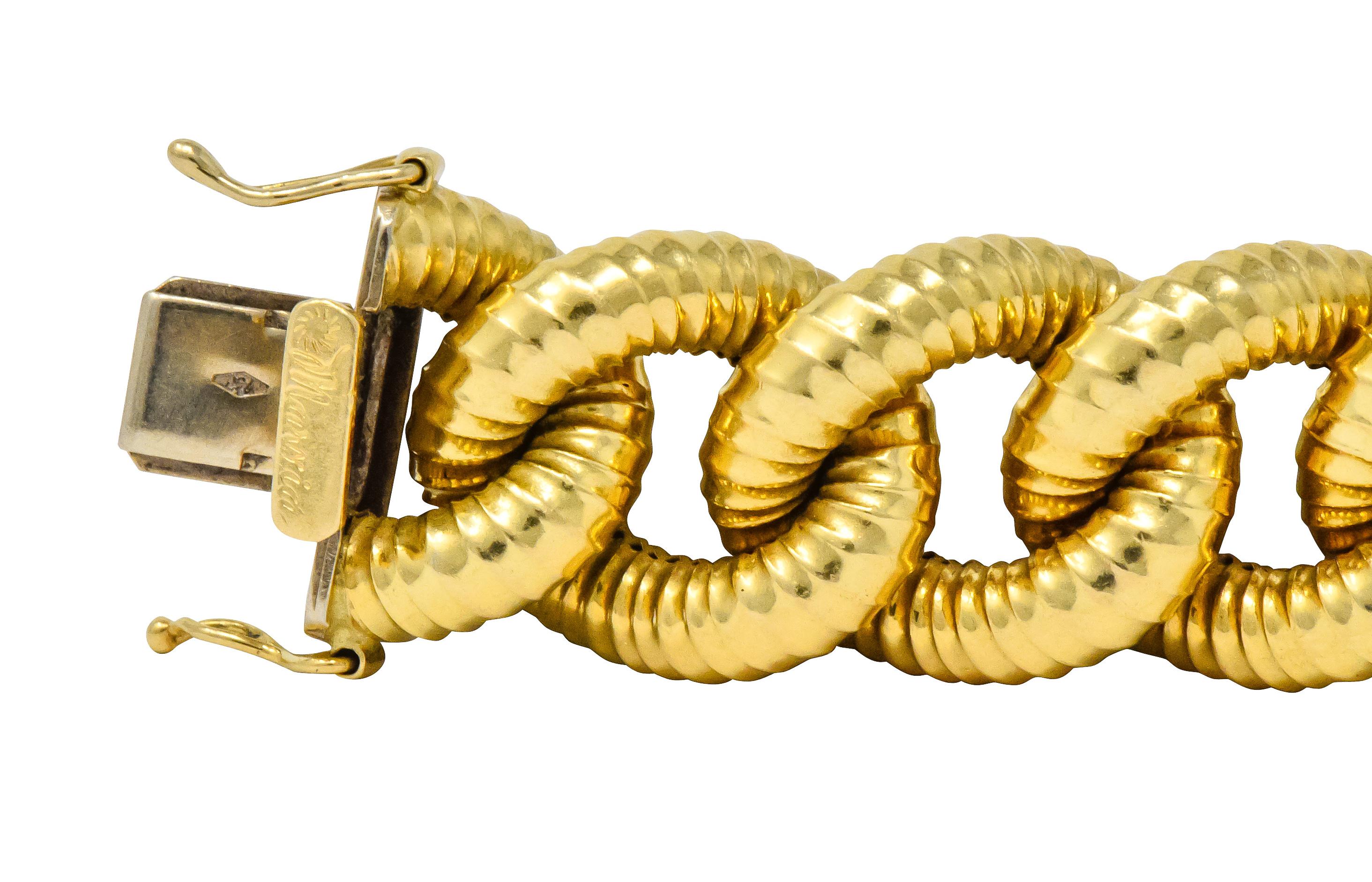 Designed as large, hollow, ribbed curb links throughout

With concealed clasp and double figure-eight safeties

With maker's mark

Stamped 750 for 18 karat gold

Length: 7 3/4 inches

Width: 1/2 (widest) inch

Total weight: 50.0 grams

Chunky.