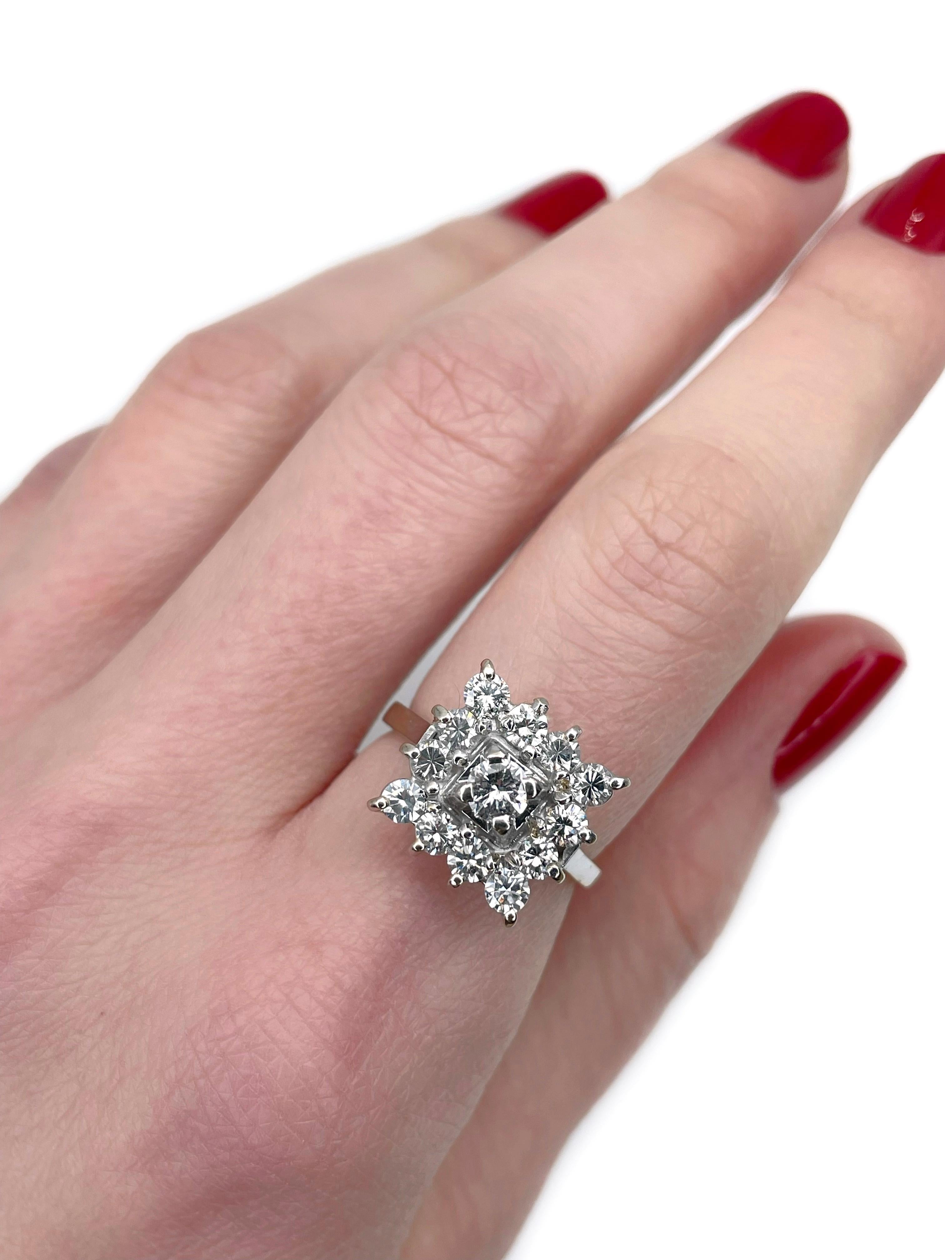 This is a vintage cocktail ring crafted in 18K white gold. Circa 1980. 

The piece features diamonds (TW 1.17ct):
- 1 diamond (round brilliant cut, 0.22ct, RW-W, SI)
- 12 diamonds (RBC-33/57, 0.95ct, RW-W, VS-SI)

Weight: 4.59g
Size: 16.25 (US