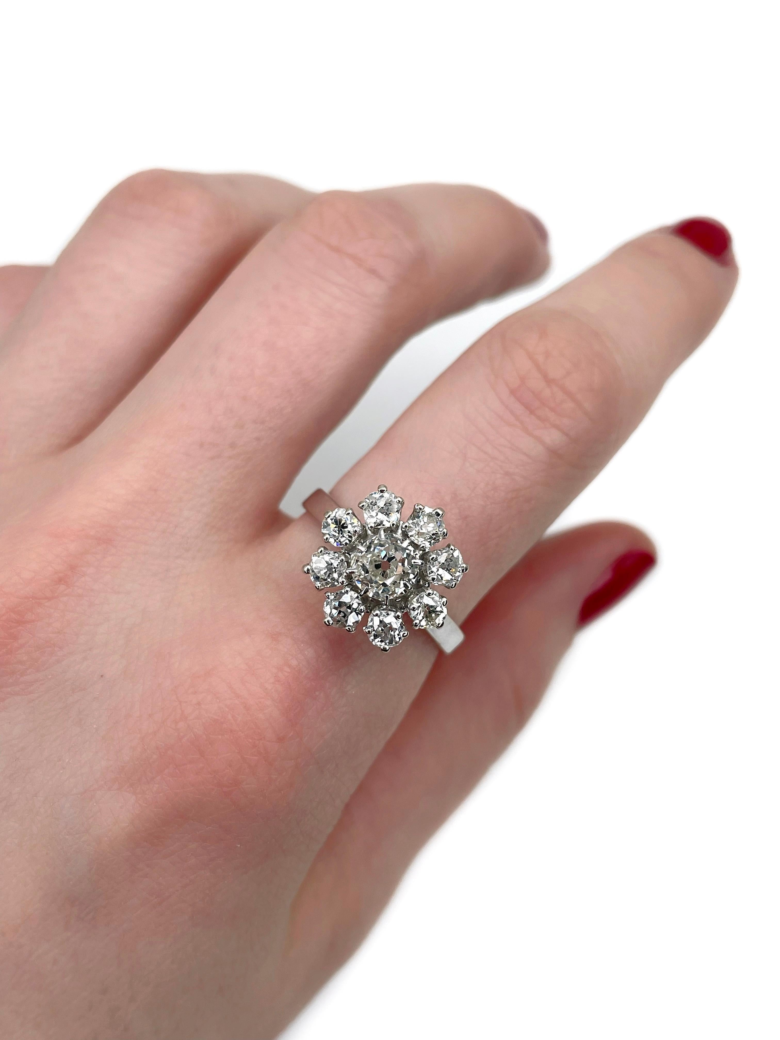This is a vintage cluster ring crafted in 18K white gold. Circa 1960. 

The piece features diamonds (TW 1.60ct):
- 1 diamond, old mine cut, 0.60ct, W-STW, SI
- 8 diamonds, old mine cut, TW 1.00ct, RW+/RW, VS-SI

Weight: 4.58g
Size: 18.25 (US